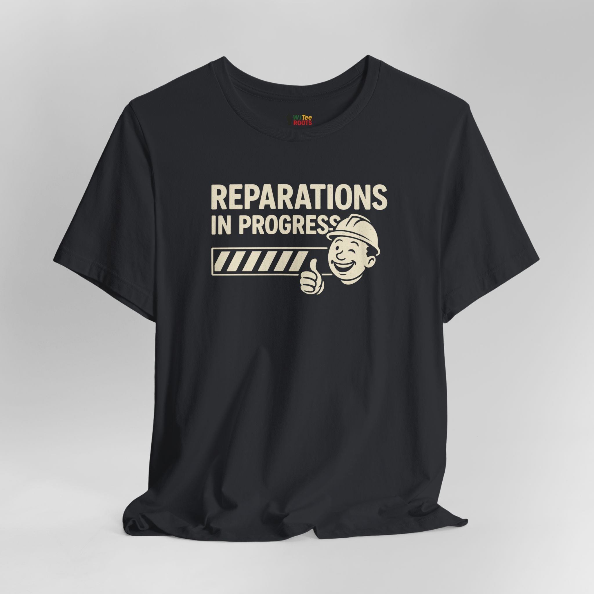 Black t-shirt with 'Reparations in Progress' graphic on a gray background