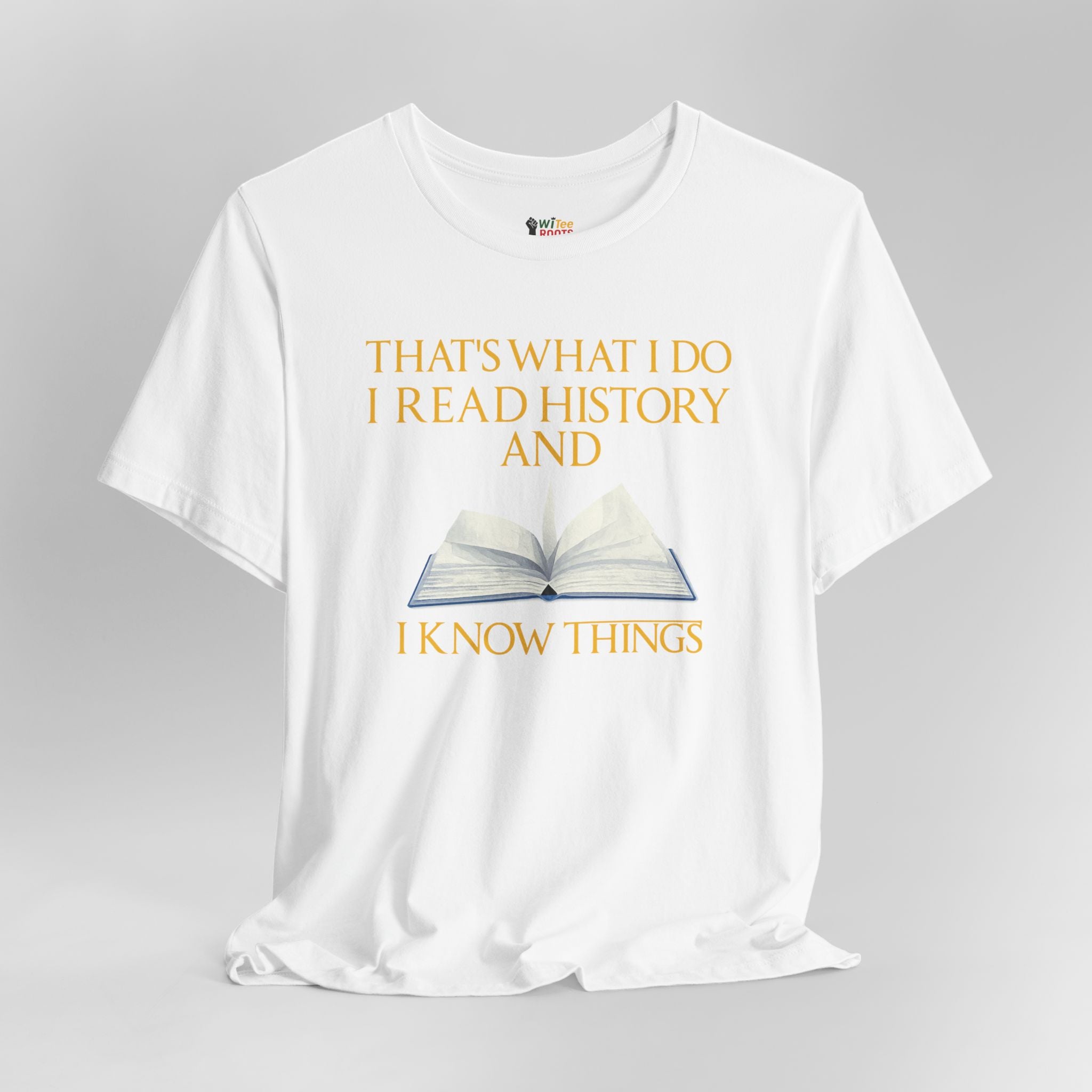 White t-shirt with a graphic of an open book and text on a gray background