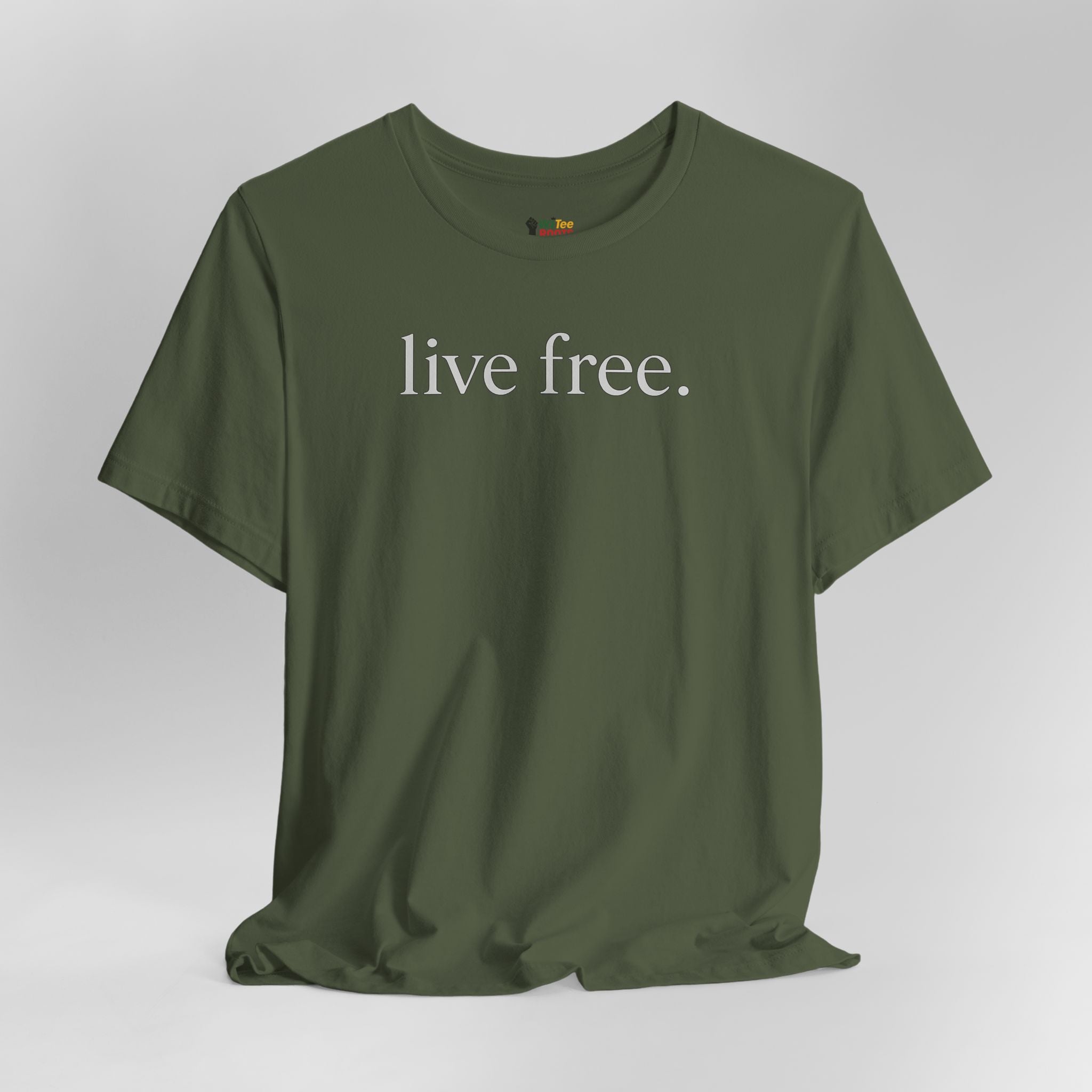 Green t-shirt with 'live free' text on a grey background.