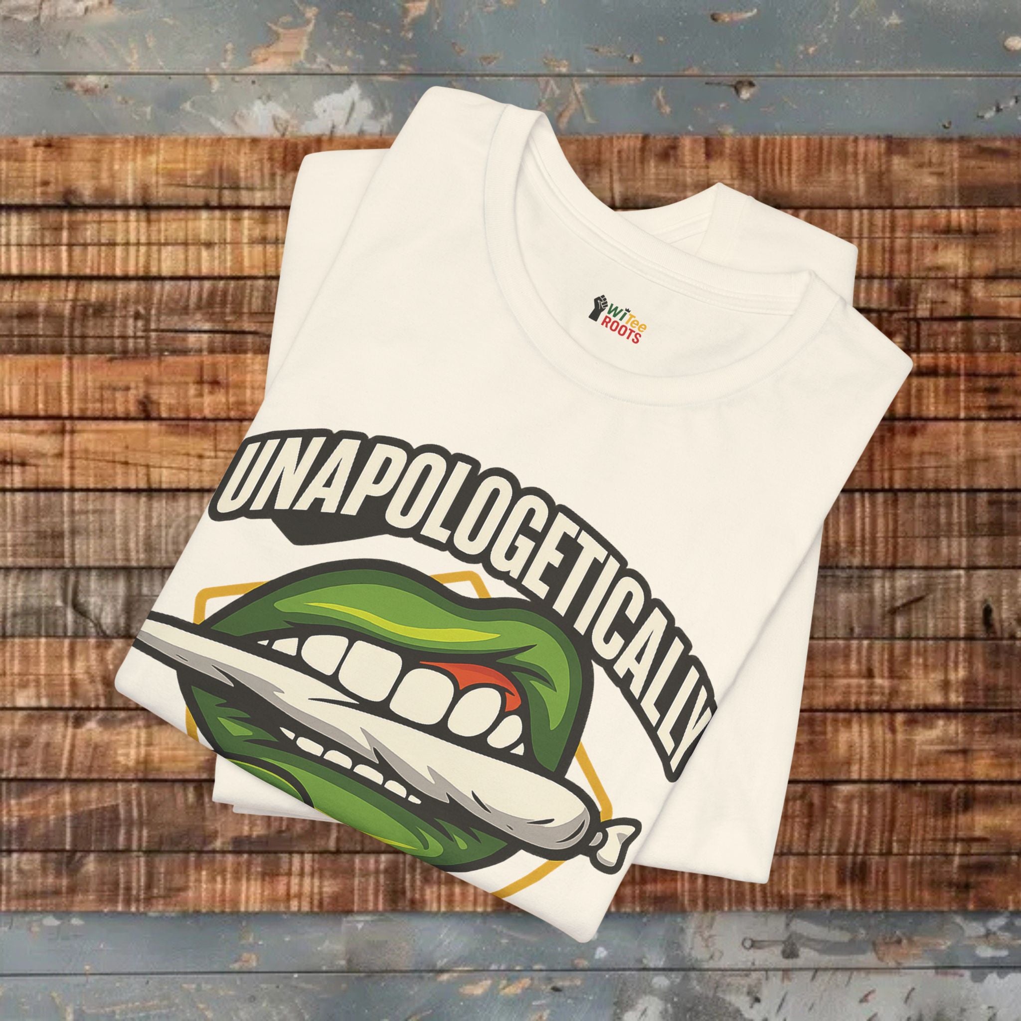 Beige t-shirt with graphic design and text on a wooden surface