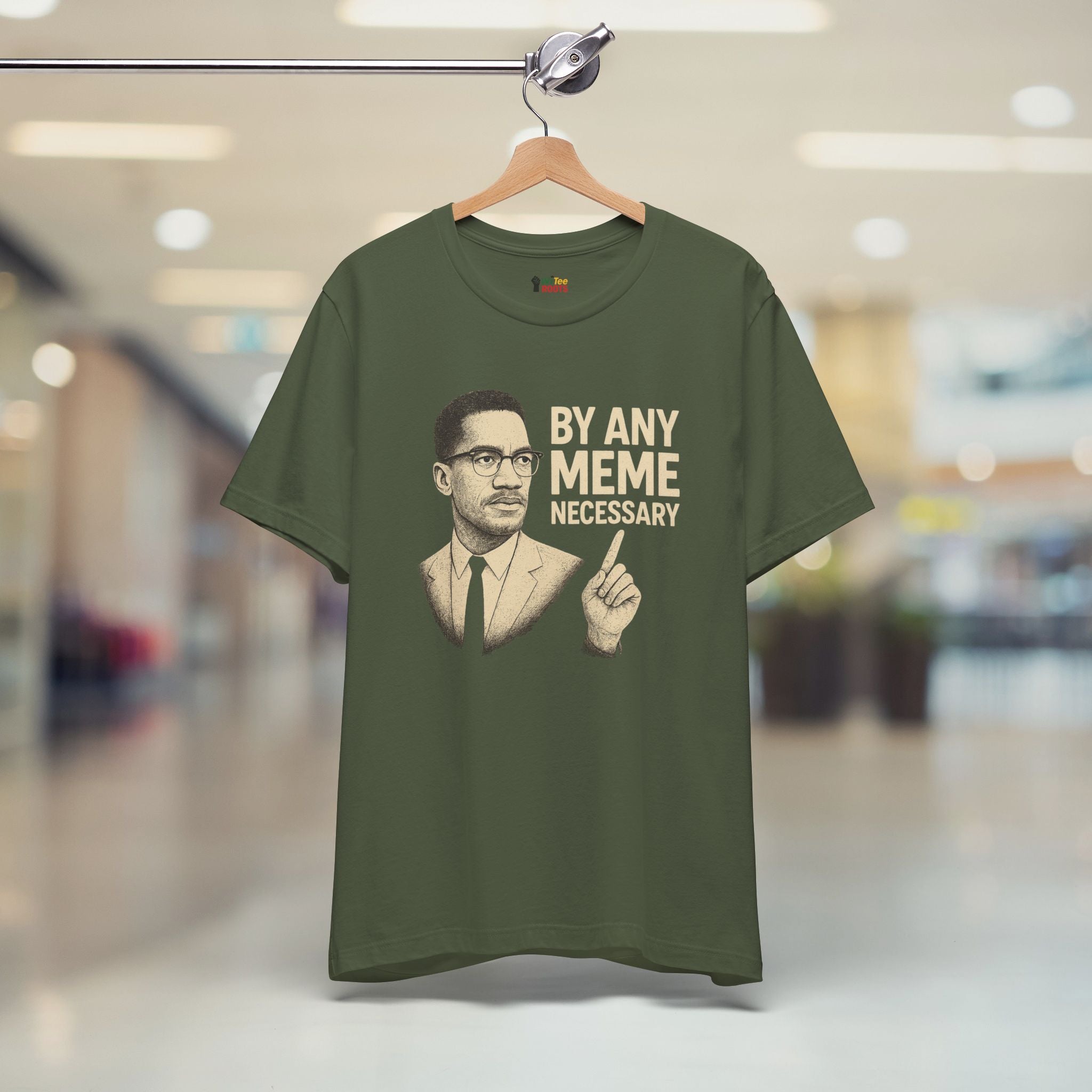 Green t-shirt with graphic and text on a hanger in a store setting