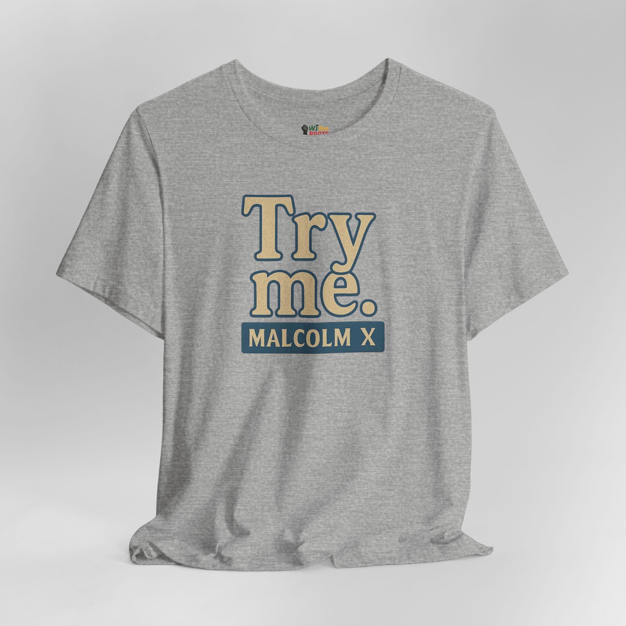 Gray t-shirt with 'Try me. MALCOLM X' text on a light gray background