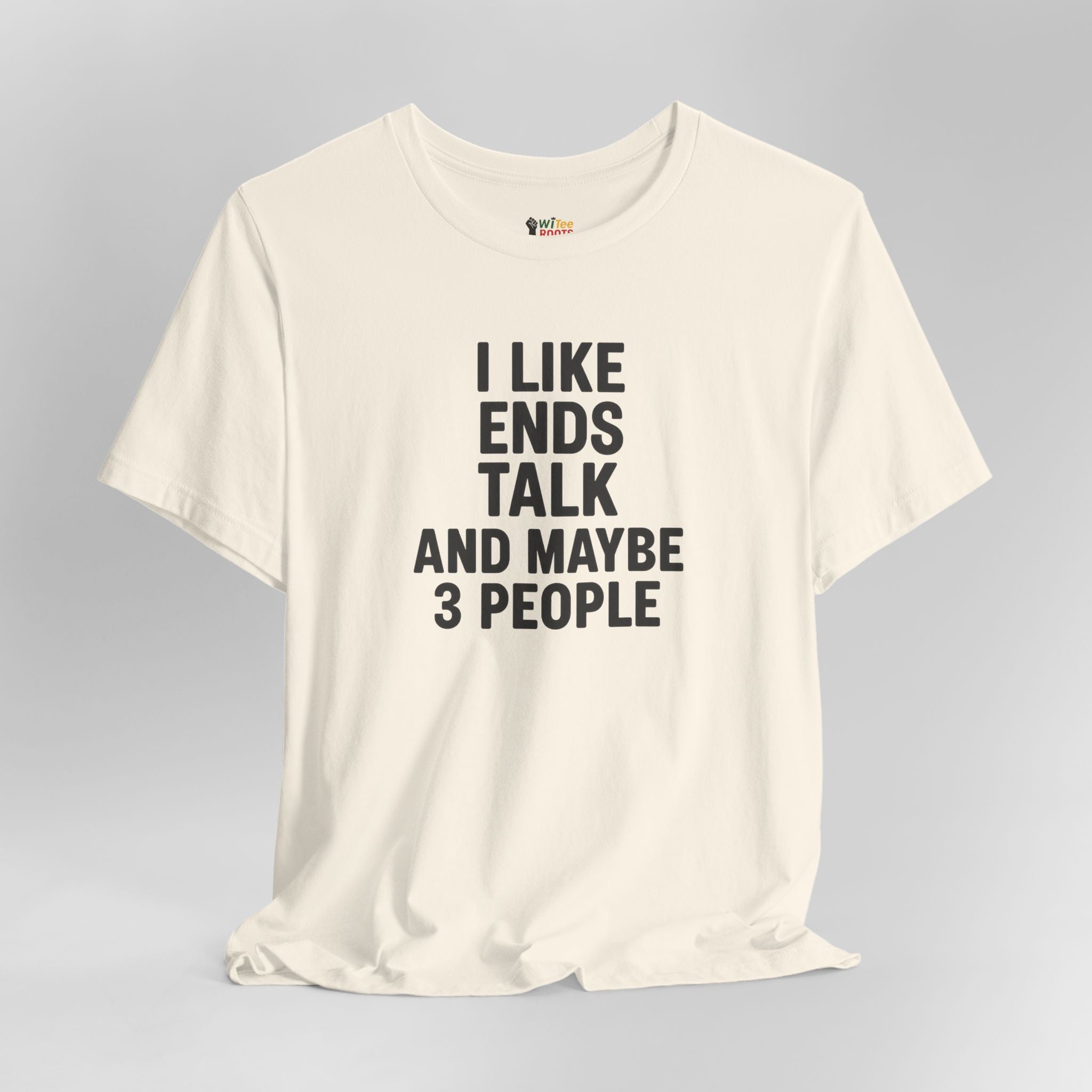 Cream t-shirt with black text on a gray background