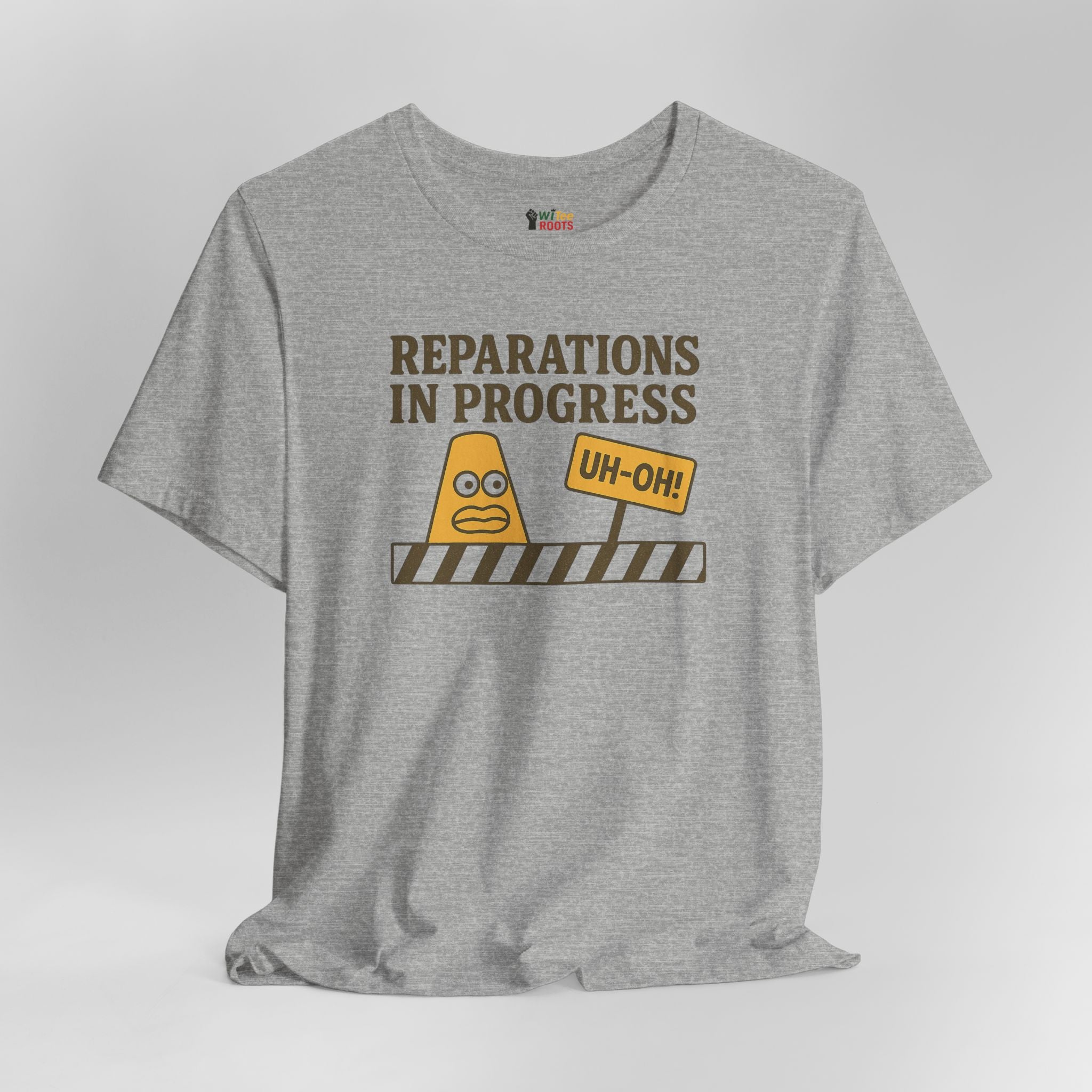 Gray t-shirt with graphic design and text 'Reparations in Progress' on a light gray background