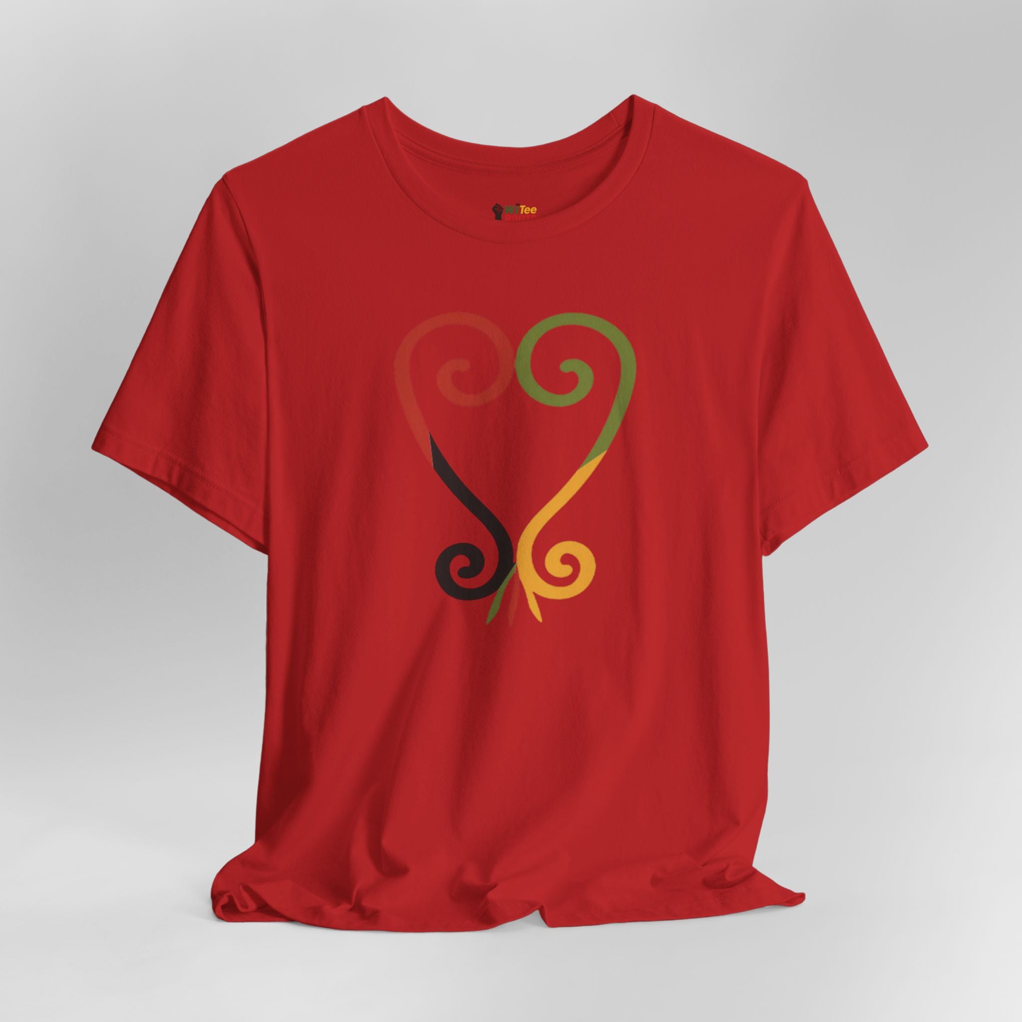 Red t-shirt with a colorful design on a gray background
