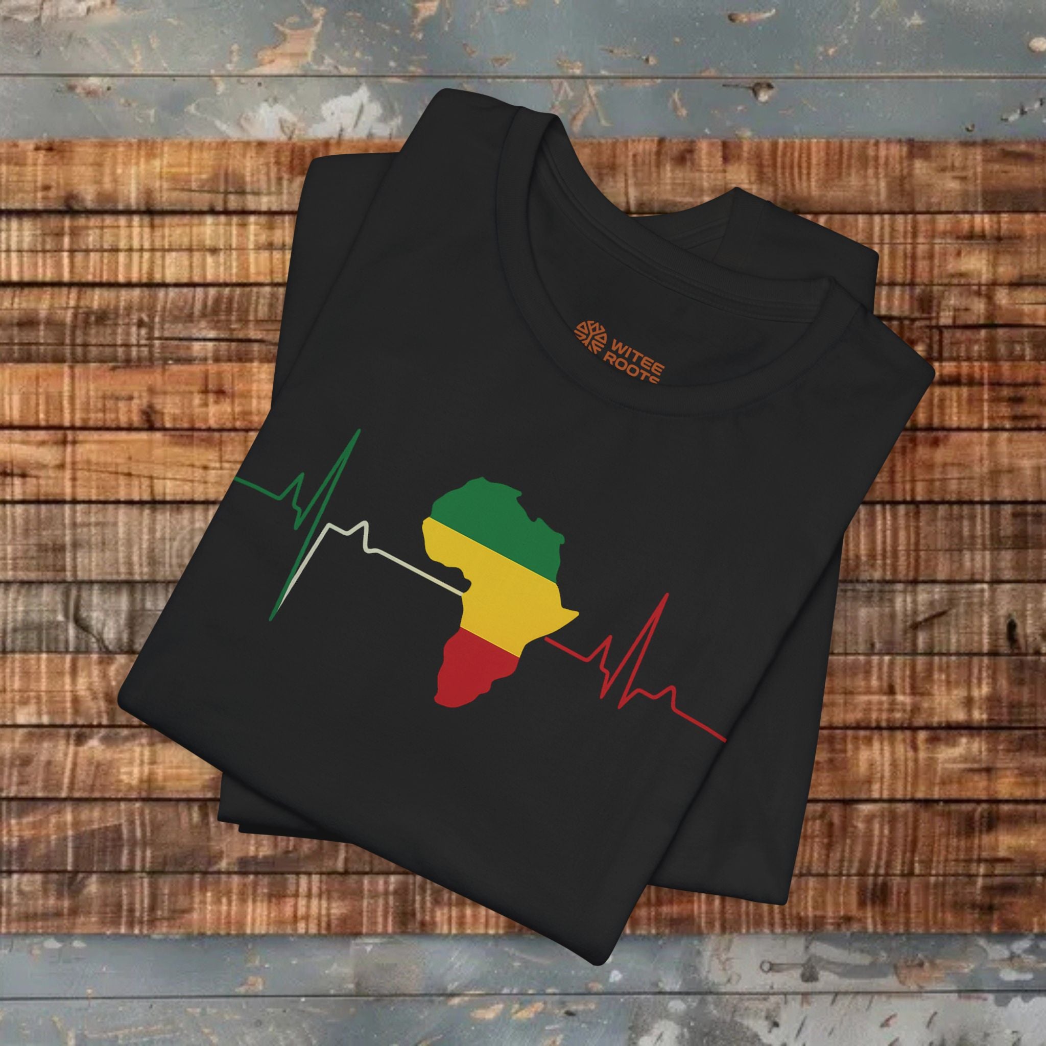 Black t-shirt with a colorful design on a wooden surface