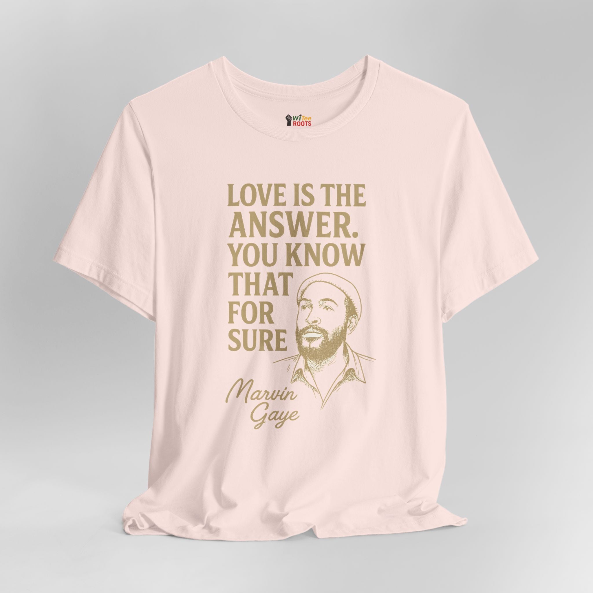 Pink t-shirt with text and a graphic of a man on a gray background