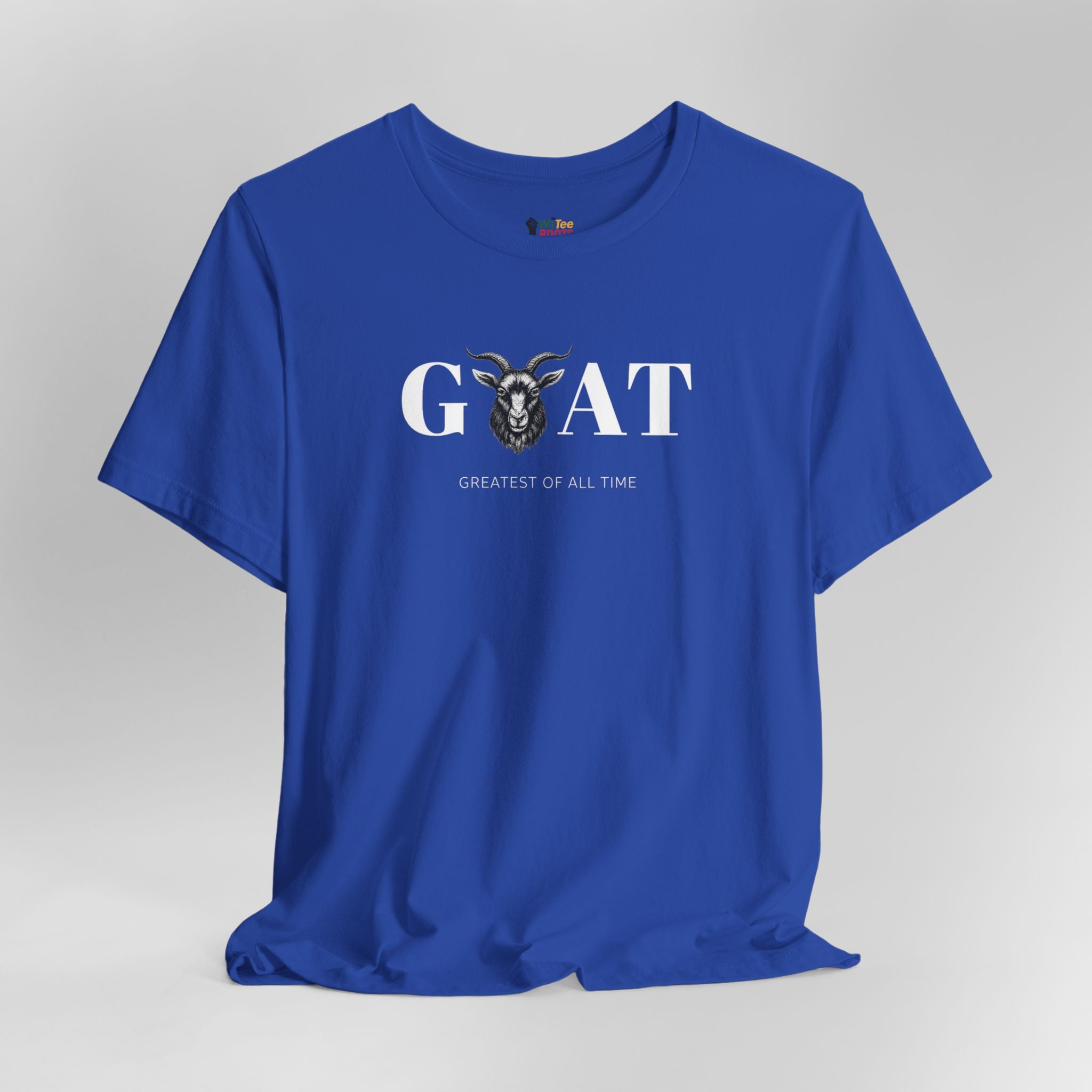 Blue t-shirt with 'Greatest of All Time' text and goat graphic on a gray background