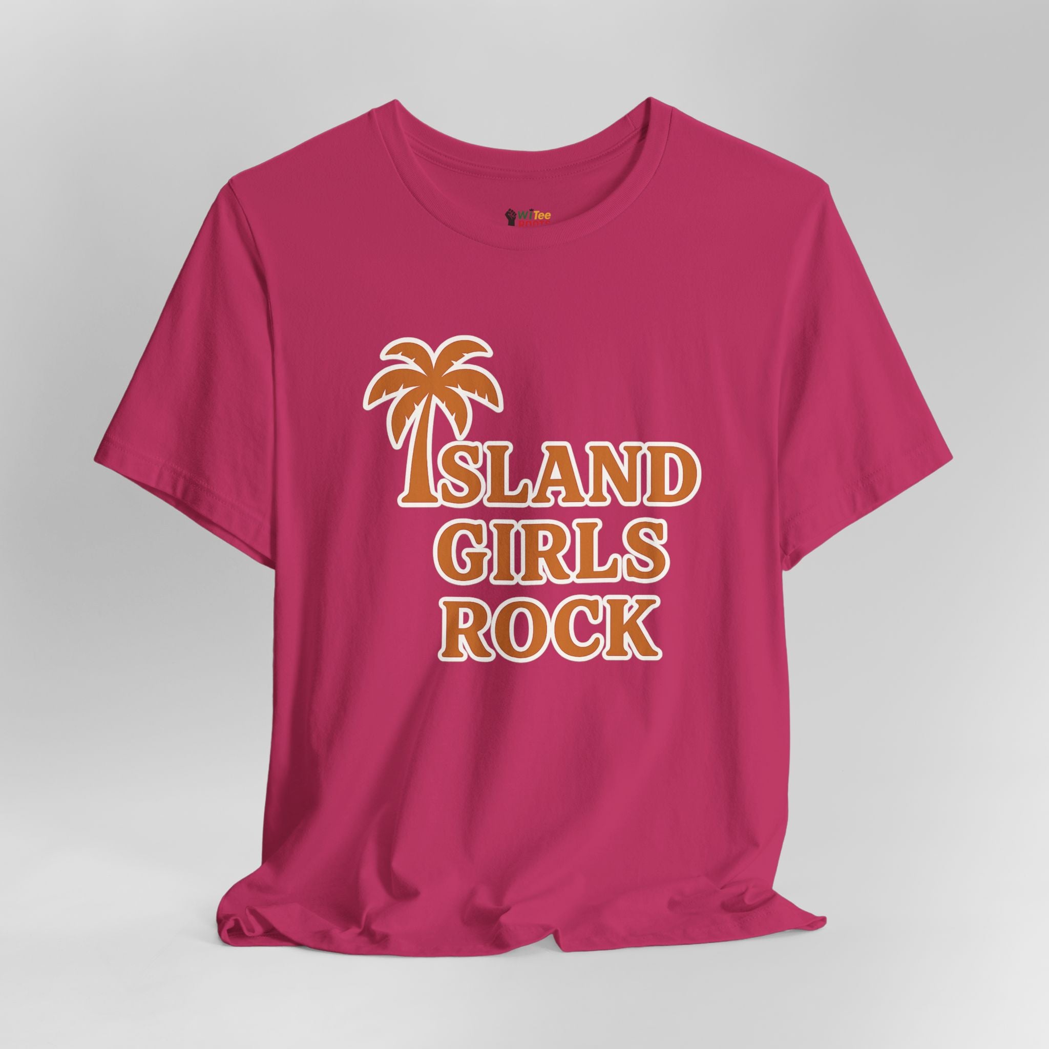 Pink t-shirt with 'Island Girls Rock' text and palm tree graphic on a gray background
