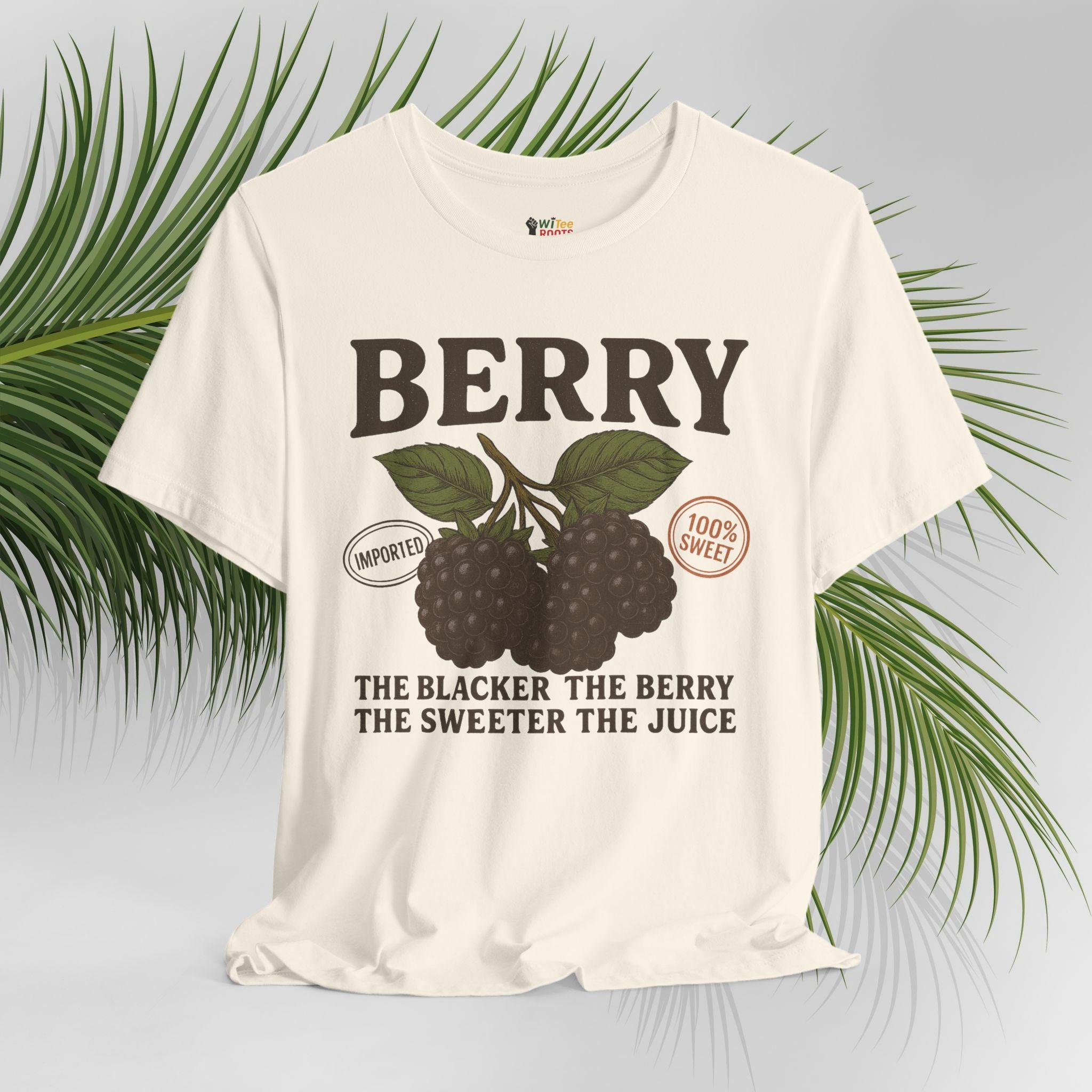 Beige t-shirt with blackberry graphic and text on a light gray background with green leaves.