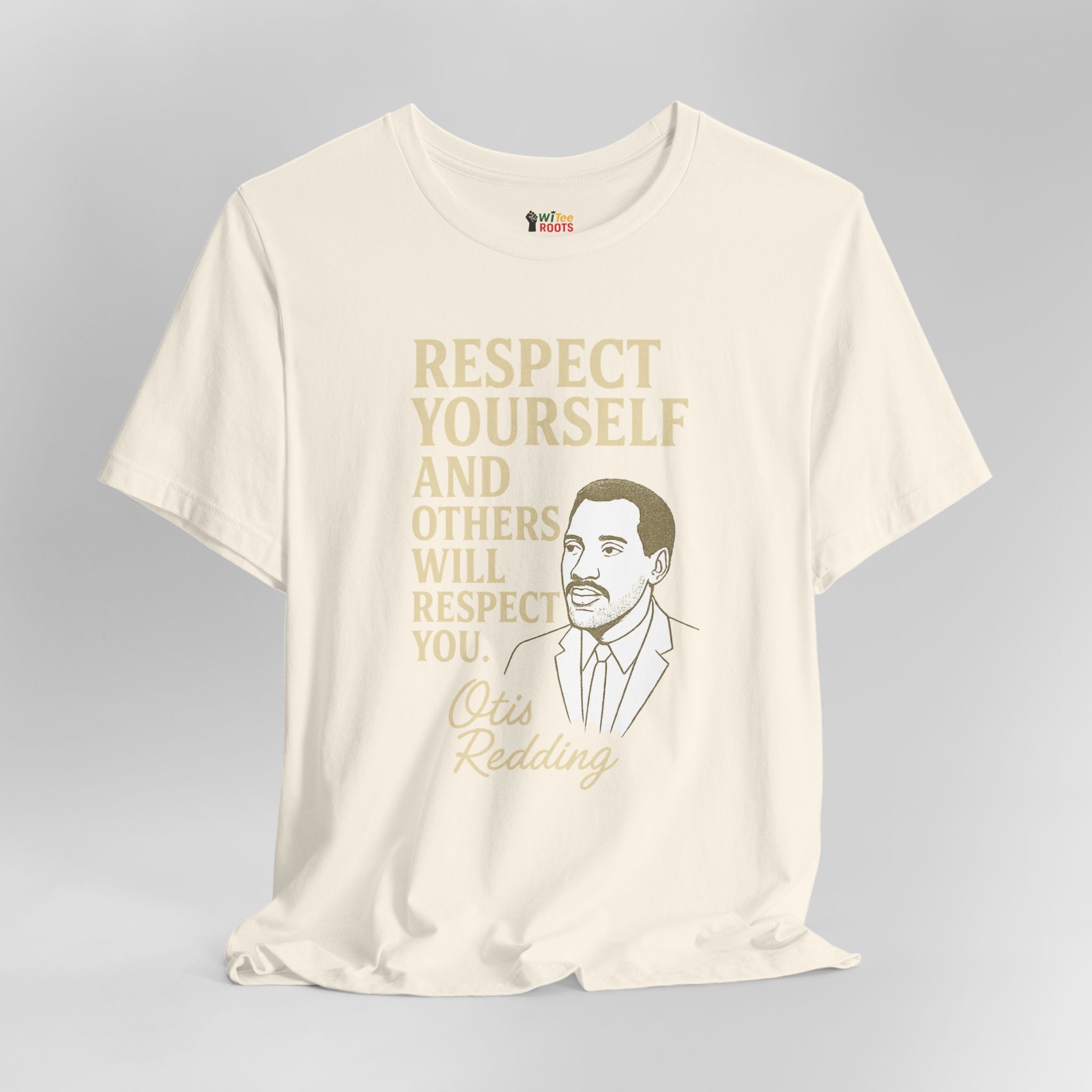 Beige t-shirt with gold text and a graphic of a man on a gray background