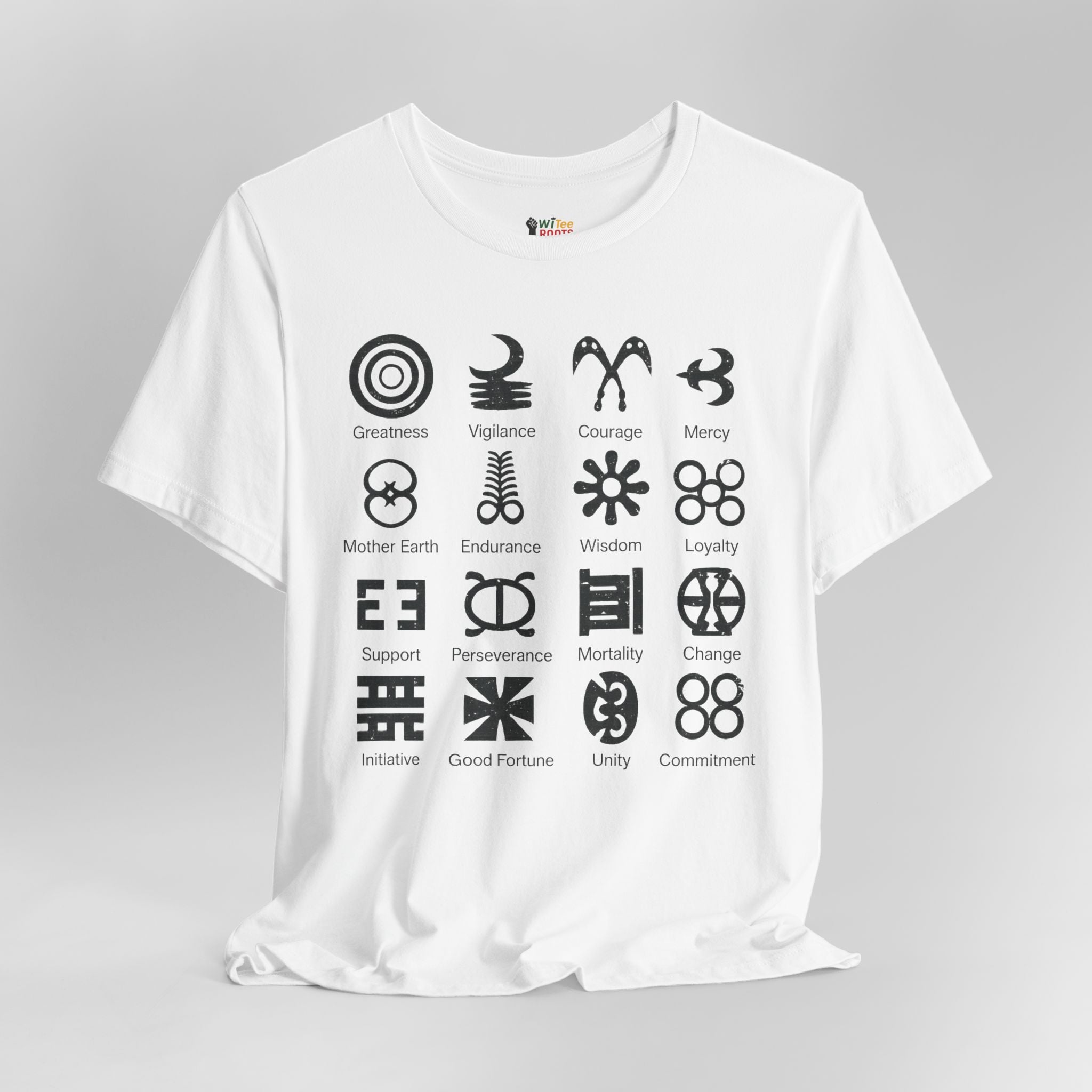 White t-shirt with black symbols and corresponding words on a gray background