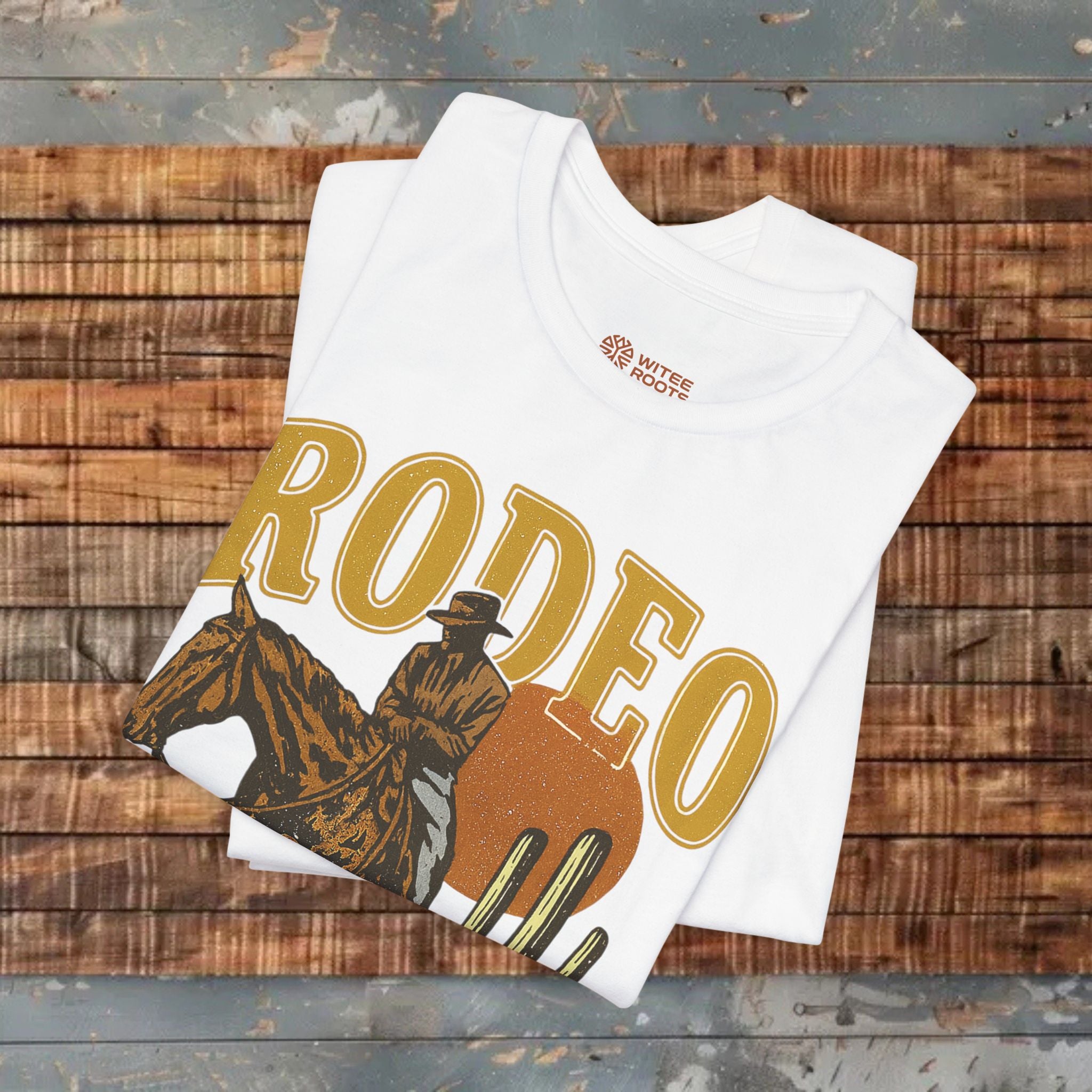 White t-shirt with 'RODEO' design on a wooden surface
