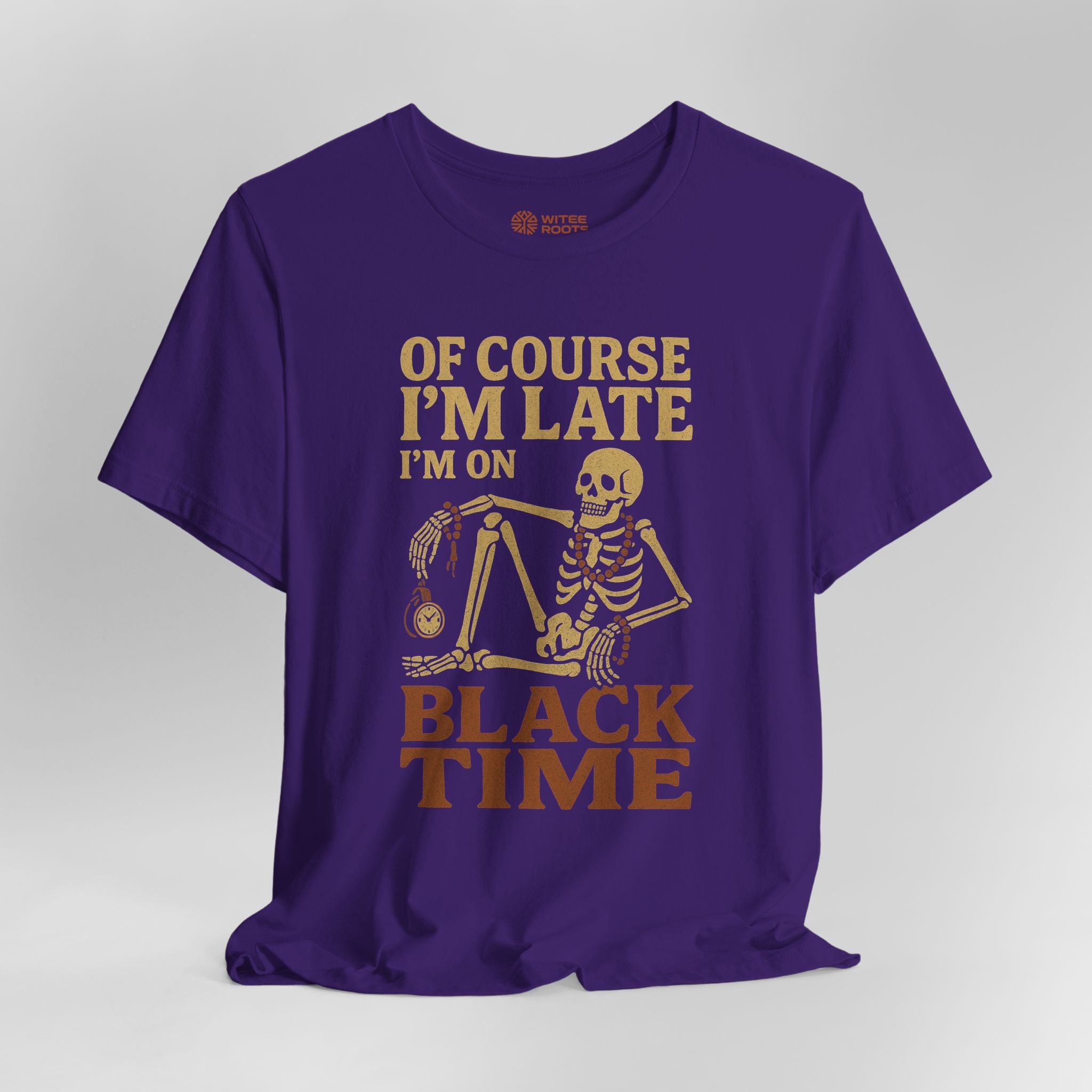 Purple t-shirt with skeleton graphic and humorous text on a gray background