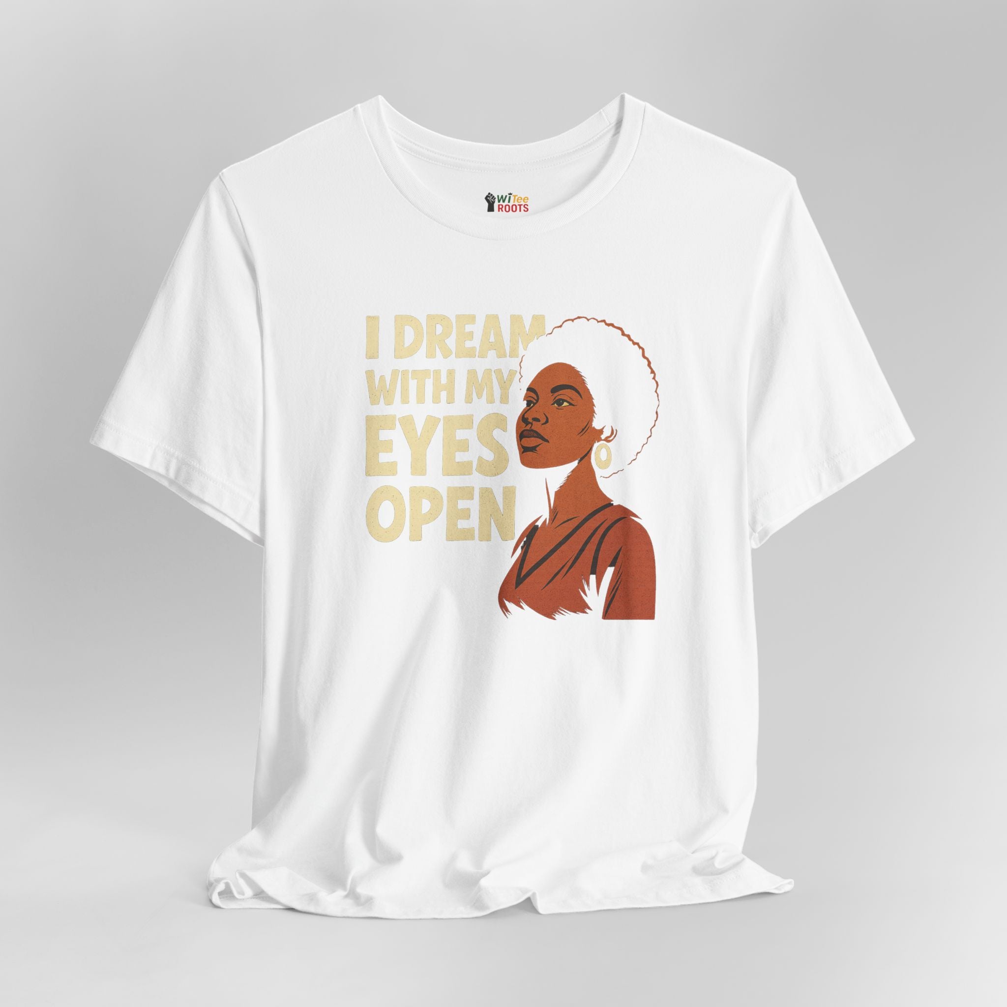 White t-shirt with a graphic of a woman and text 'I Dream With My Eyes Open' on a gray background