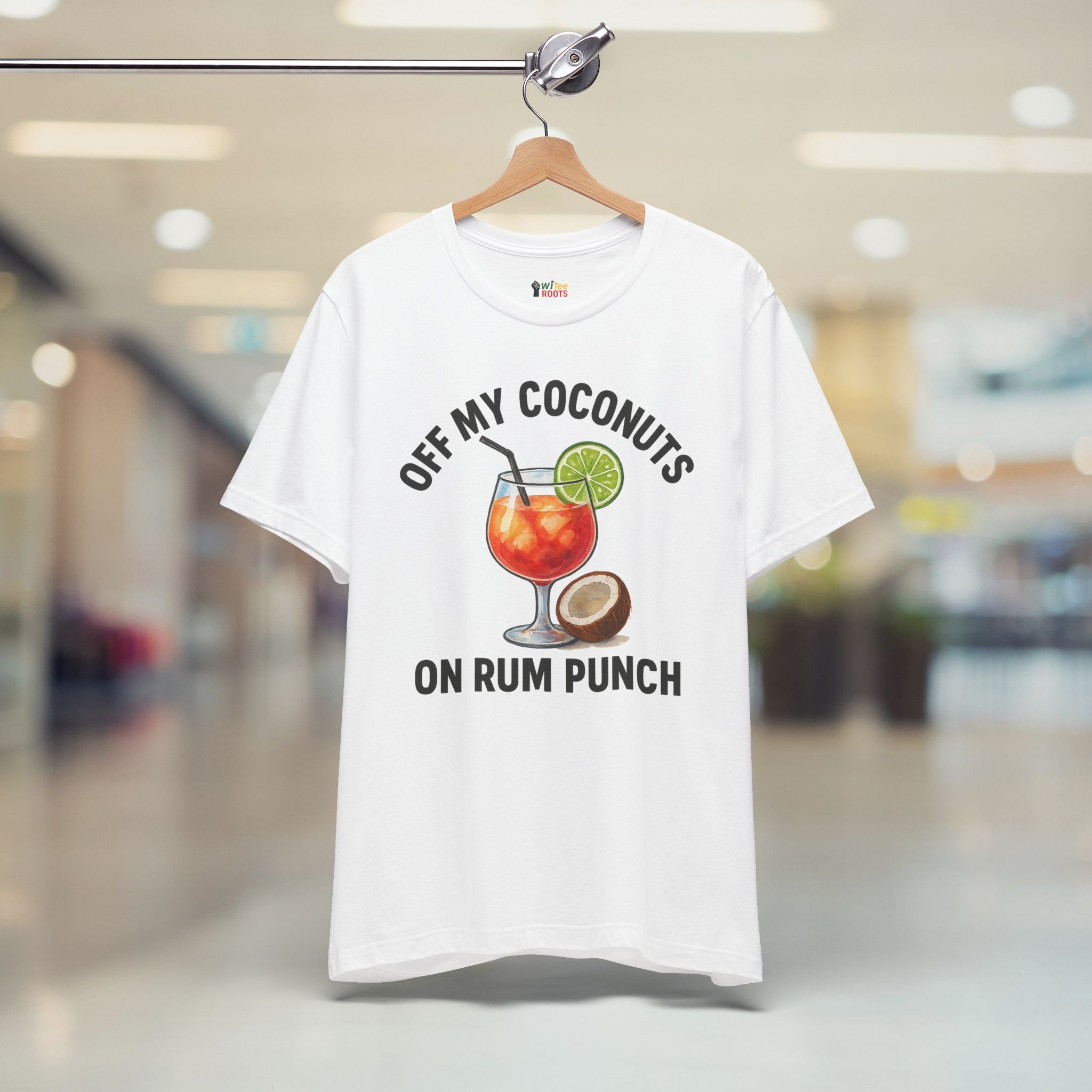 White t-shirt with a graphic design and text on a hanger in a store.