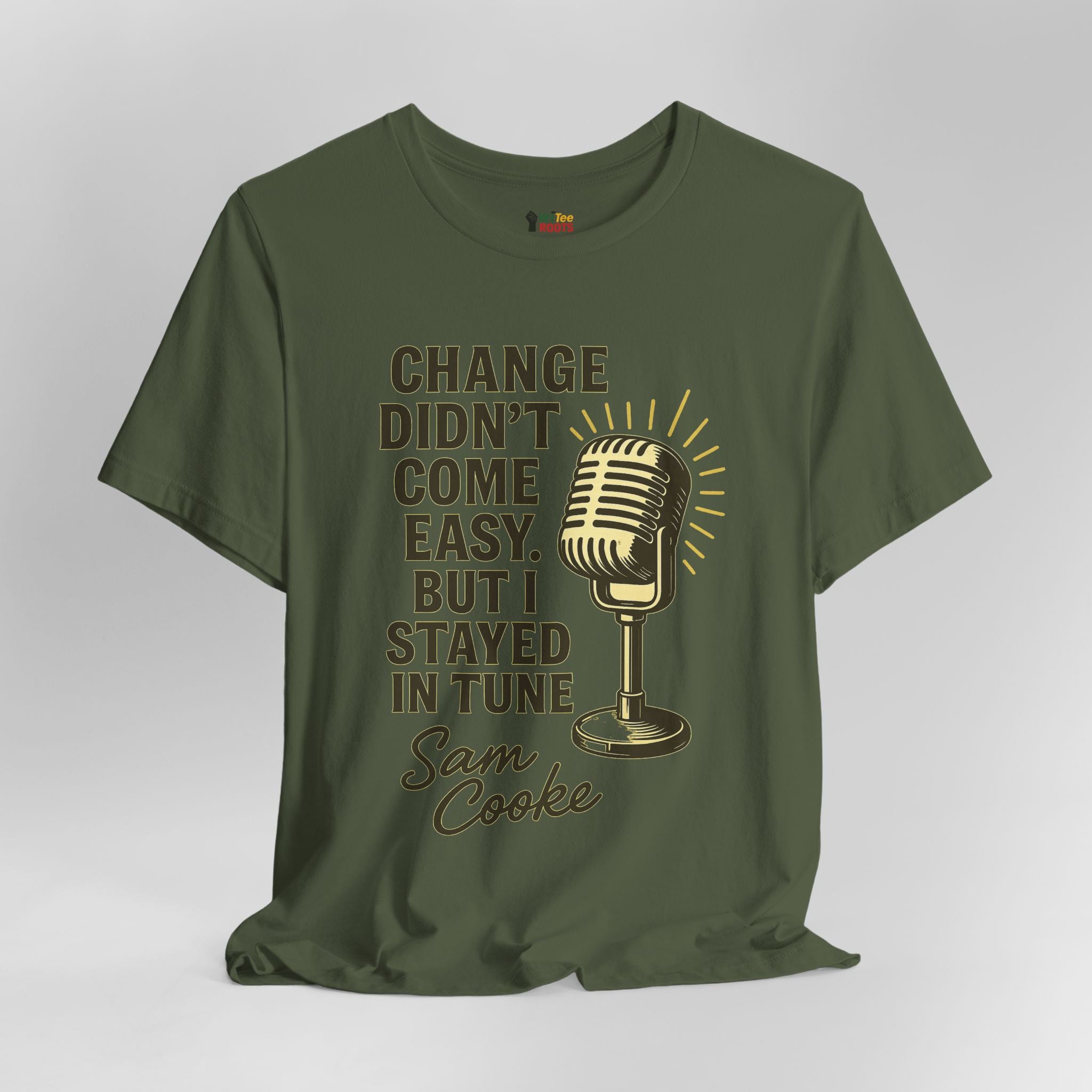 Green t-shirt with a microphone graphic and text on a gray background