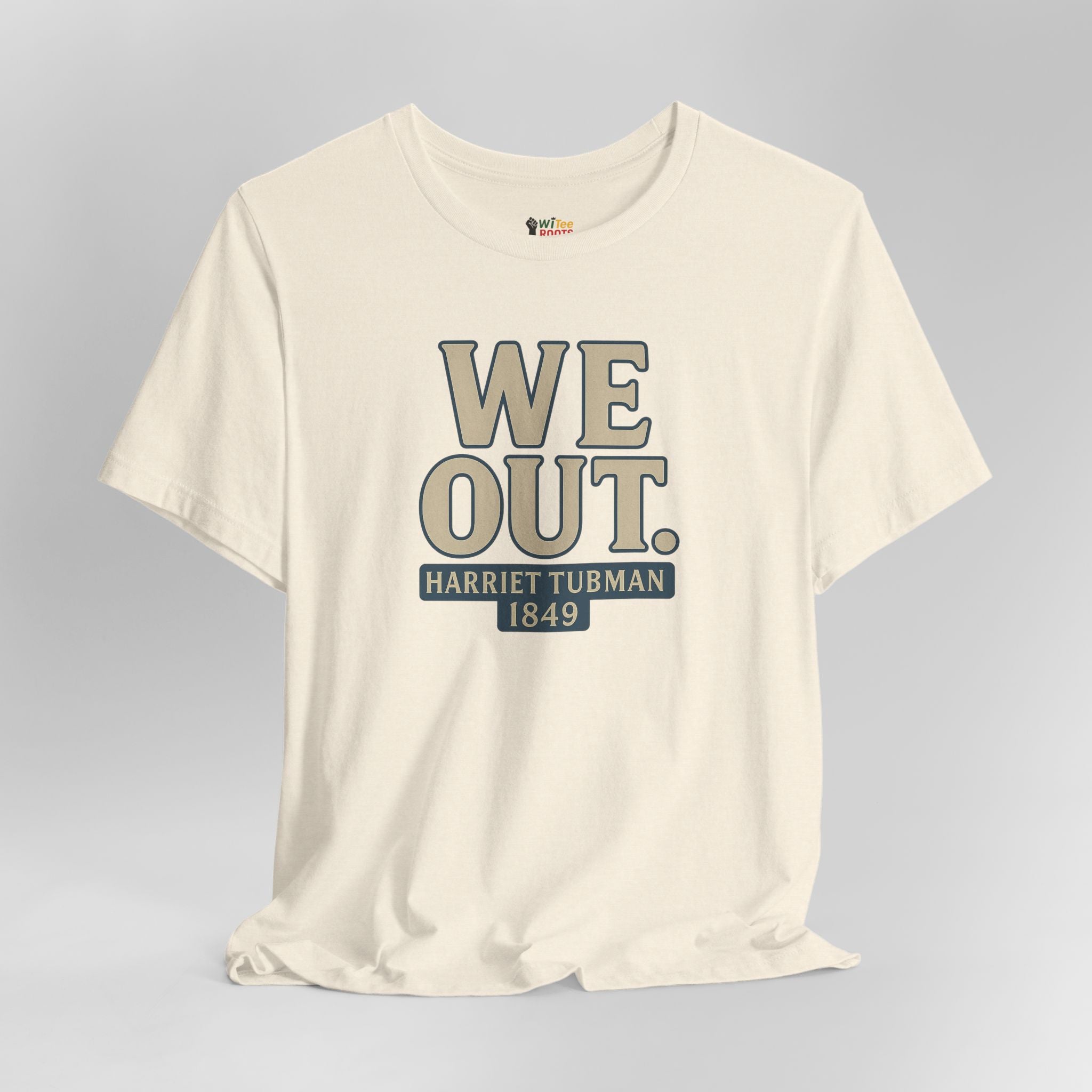 Beige t-shirt with 'WE OUT. Harriet Tubman 1849' text on a gray background