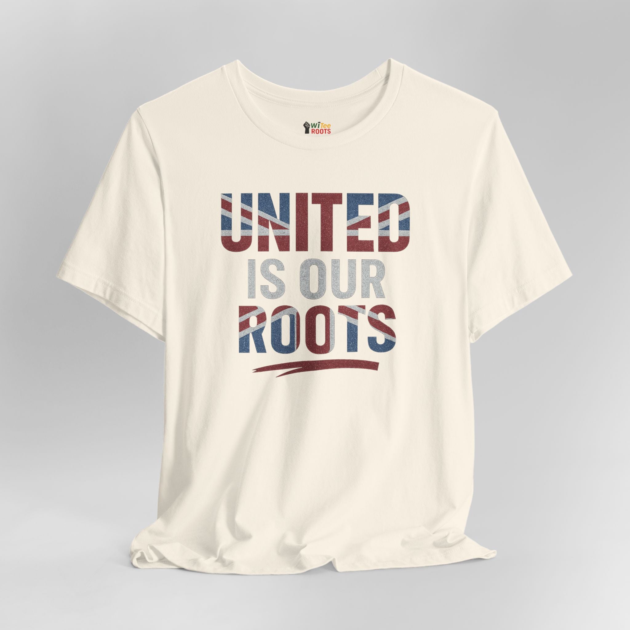 White t-shirt with 'UNITED IS OUR ROOTS' text on a gray background