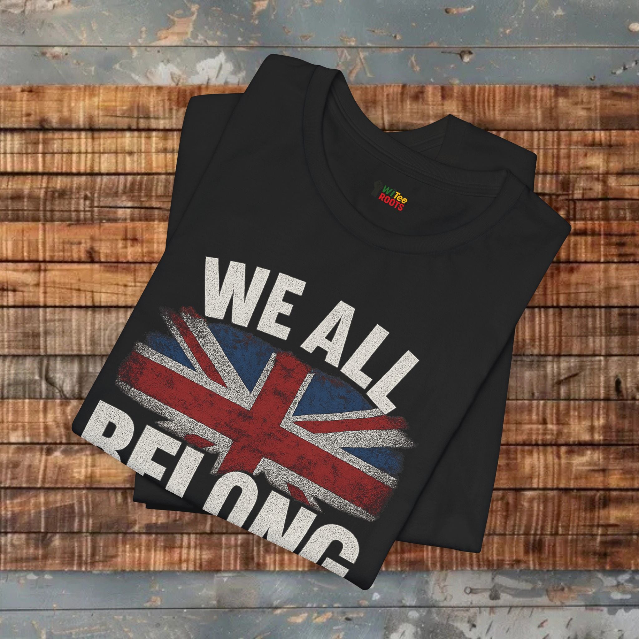 Black t-shirt with Union Jack design and text on a wooden surface