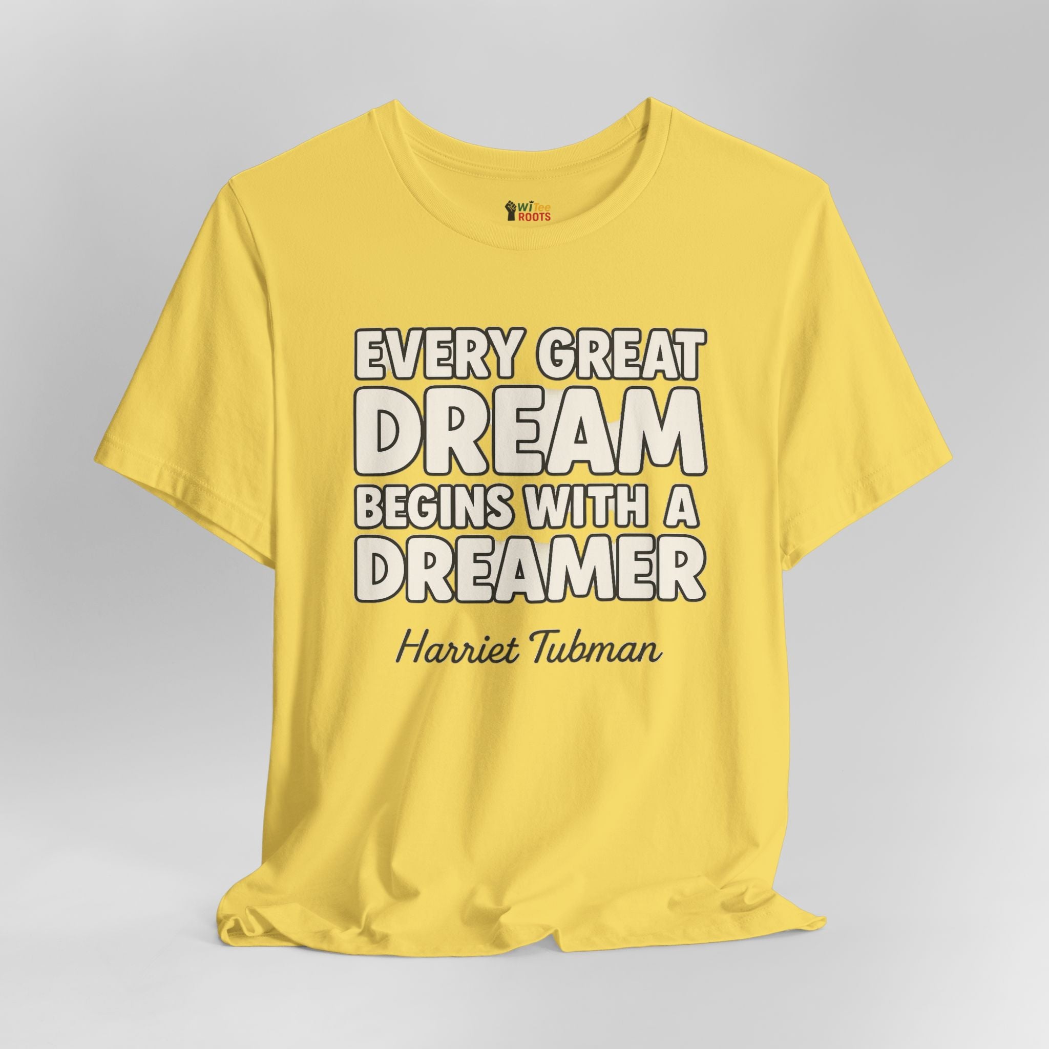 Yellow t-shirt with motivational quote on a gray background