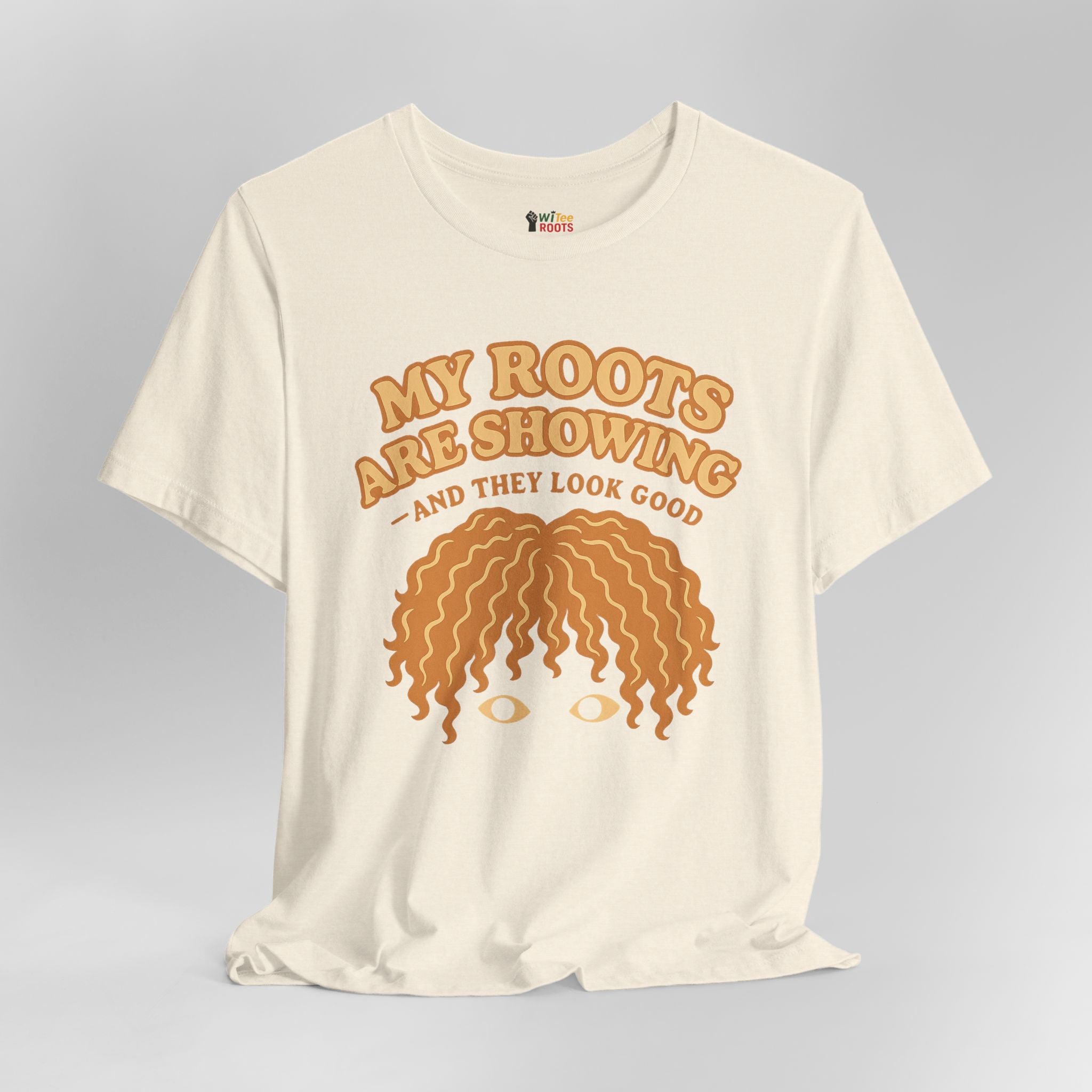 Beige t-shirt with brown text and graphic on a gray background