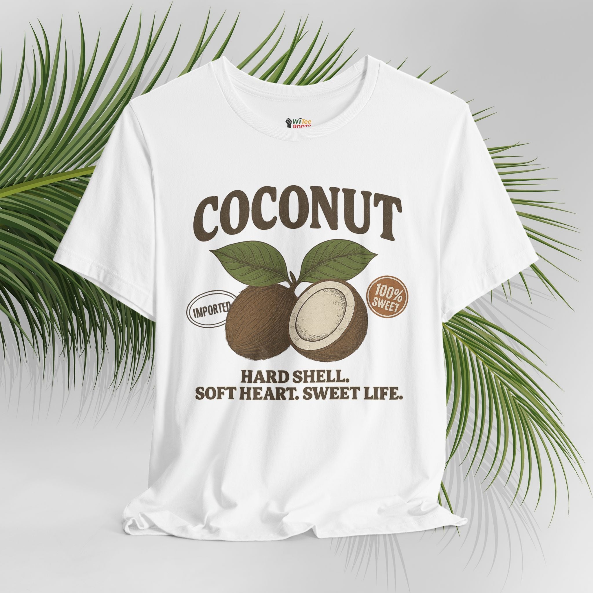 White t-shirt with coconut graphic and text on a light gray background with palm leaves.