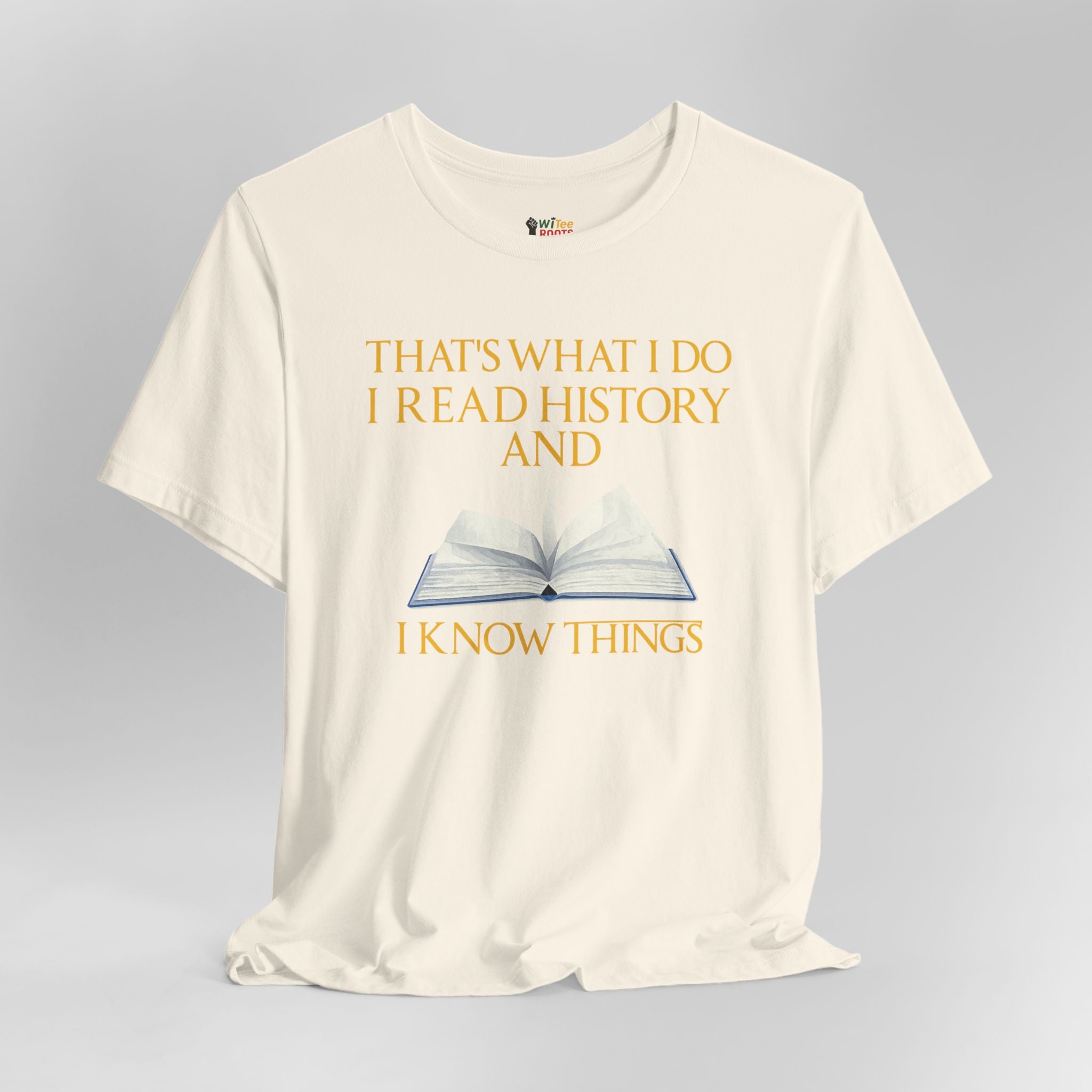Cream t-shirt with a graphic of an open book and text on a gray background