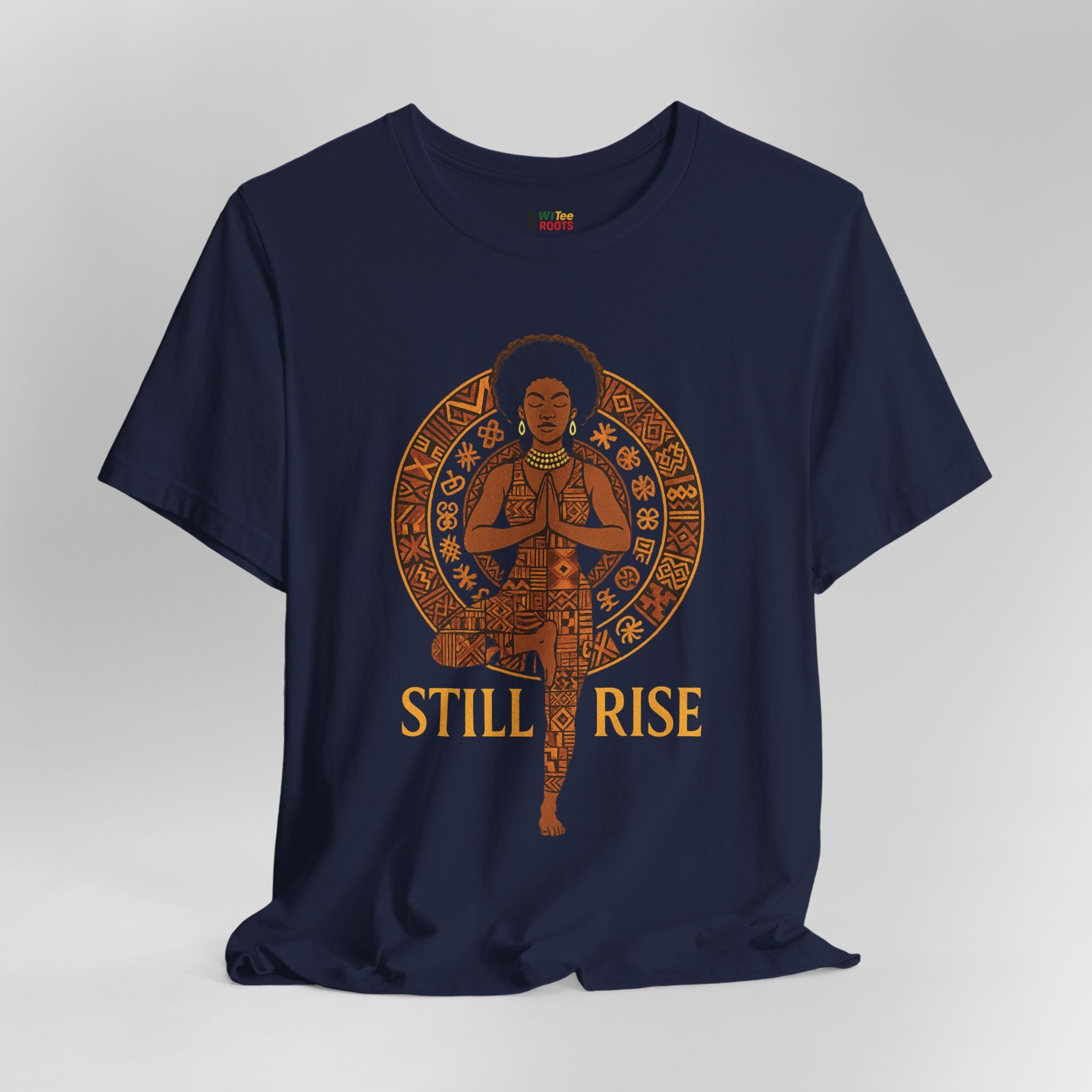 Navy blue t-shirt with a graphic of a woman in a yoga pose and 'STILL RISE' text on a gray background