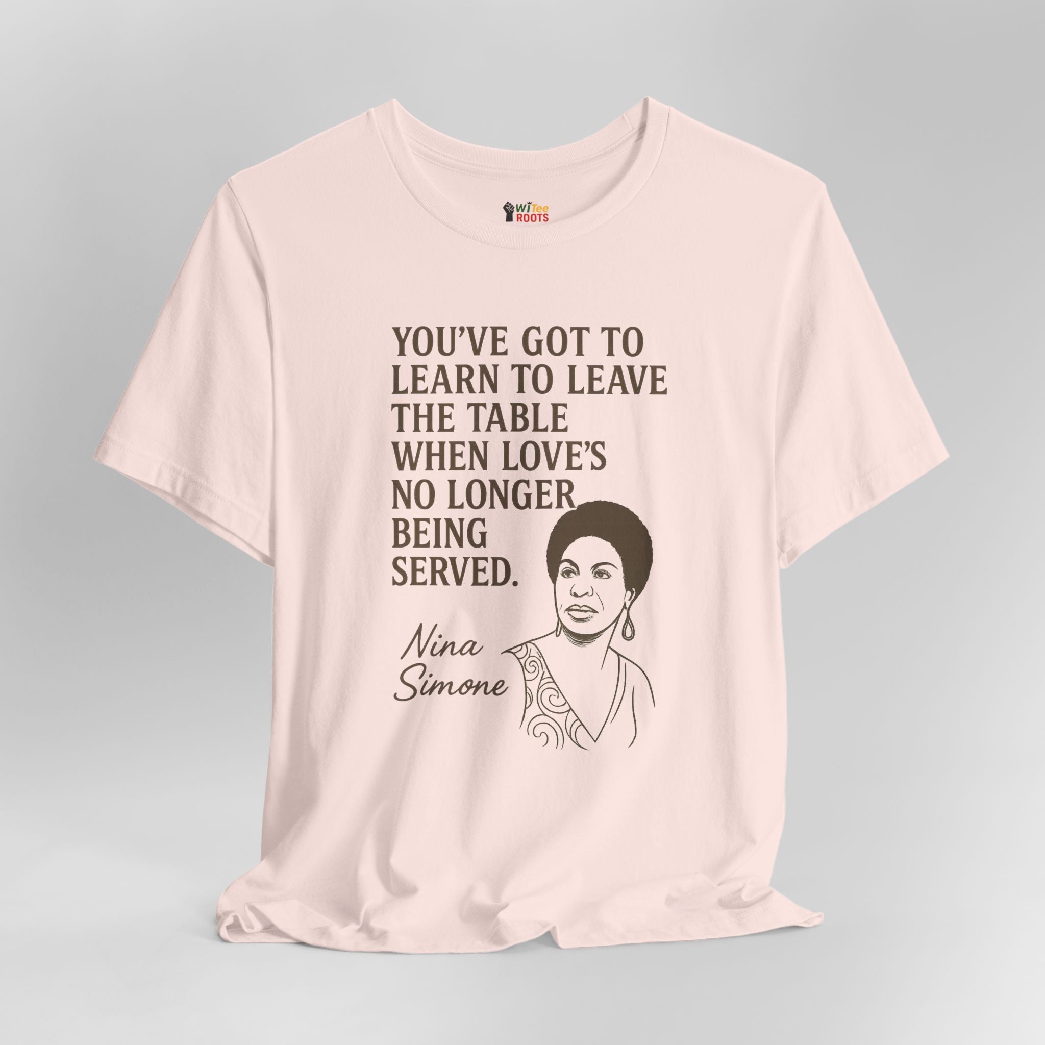 Pink t-shirt with Nina Simone quote and portrait on a gray background