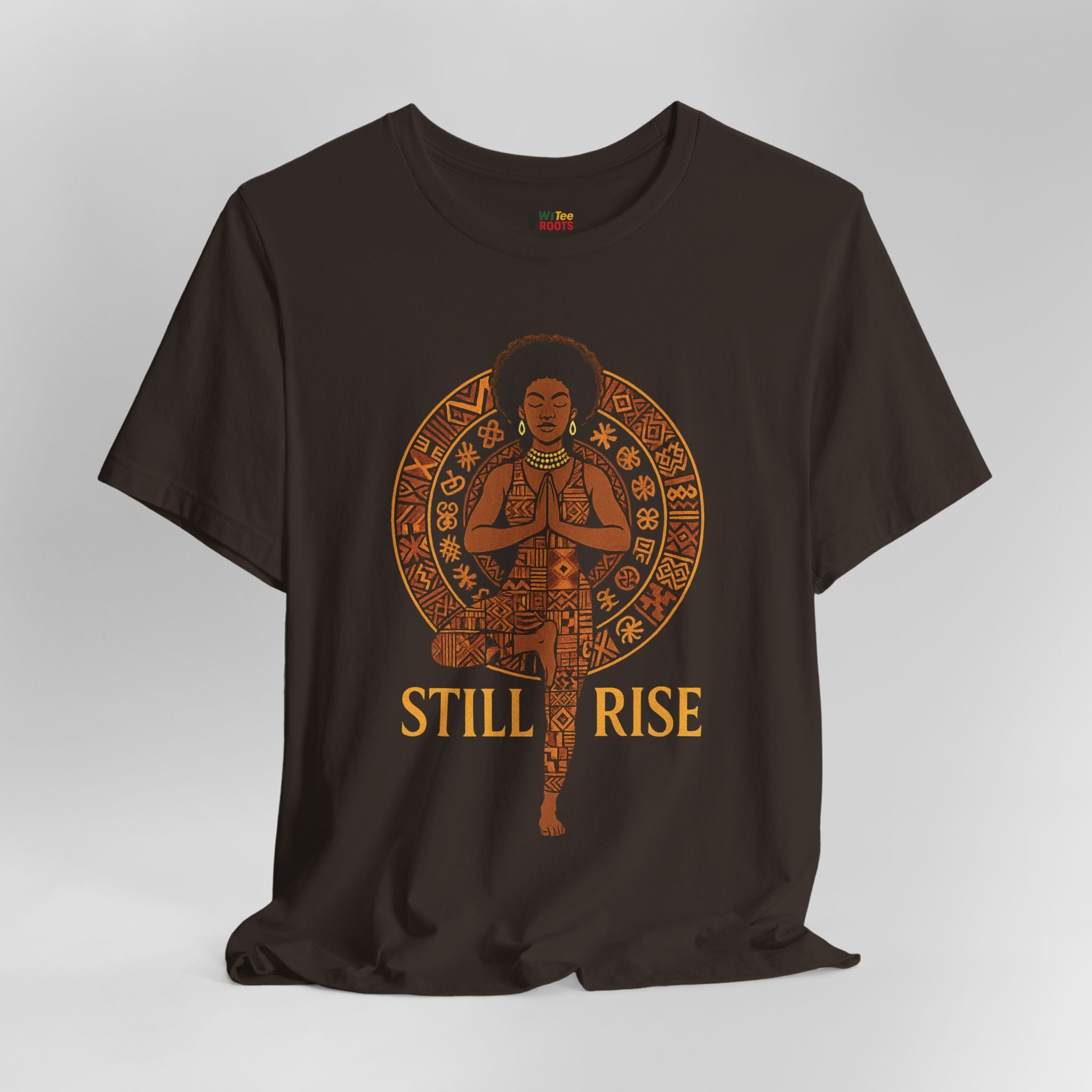 Black t-shirt with a graphic design of a woman in a meditative pose and 'STILL RISE' text on a gray background