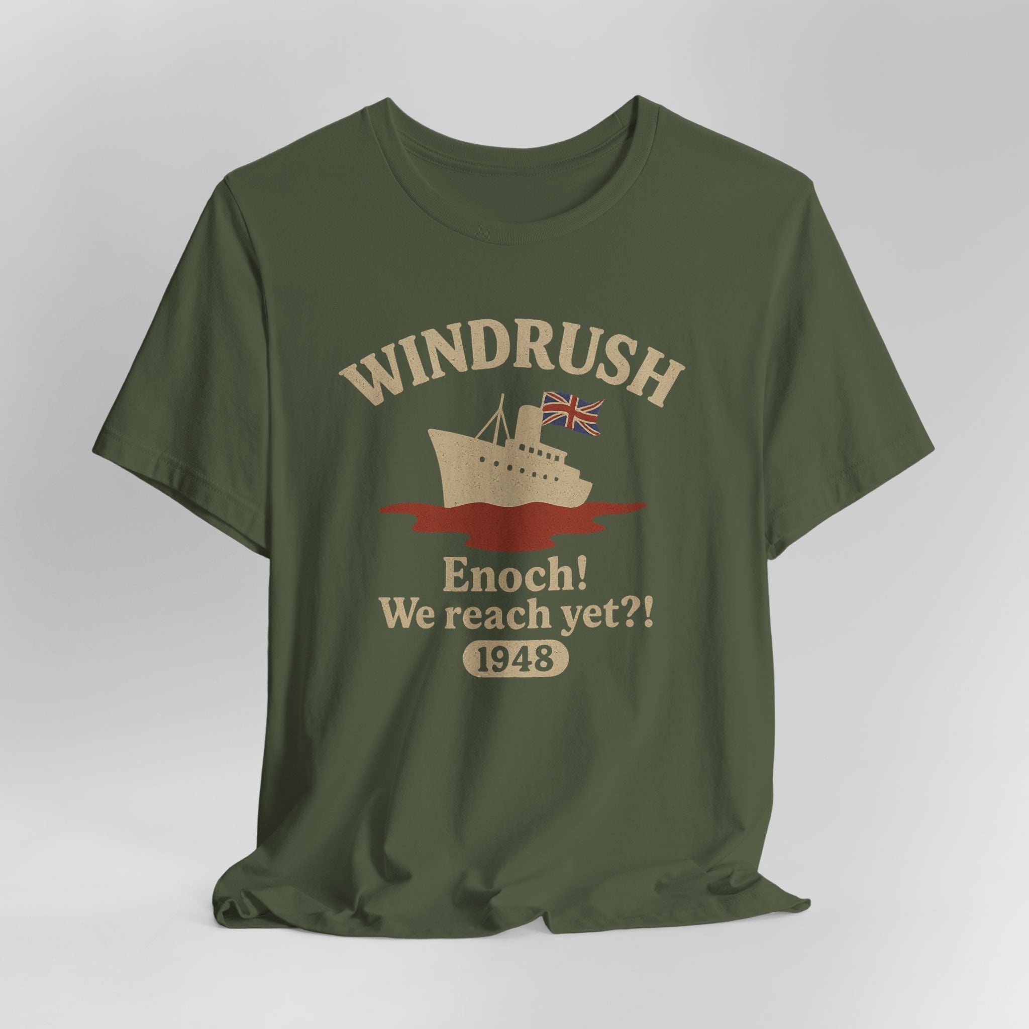 Green t-shirt with 'Windrush' design featuring a ship and text on a gray background