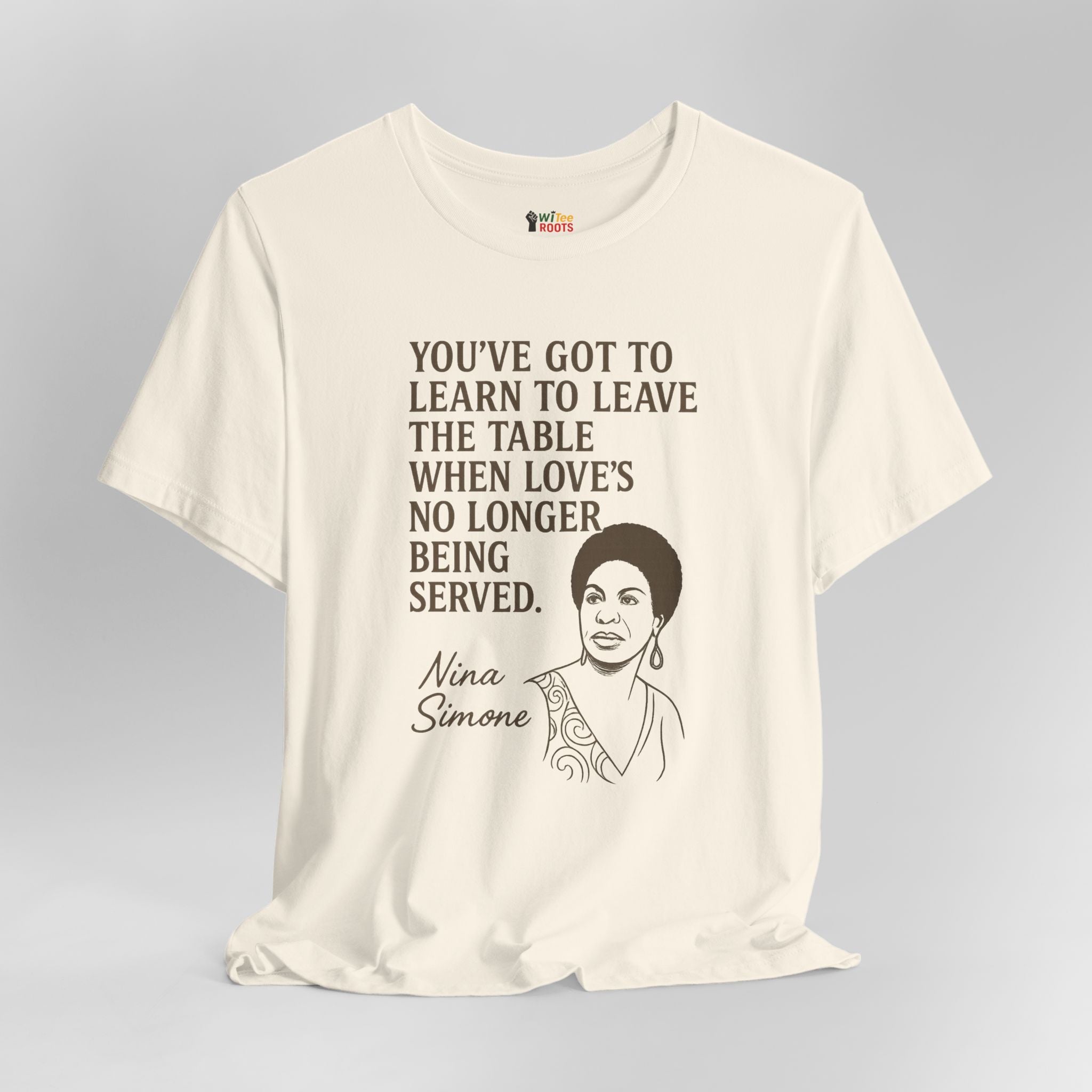 Beige t-shirt with Nina Simone quote on a gray background