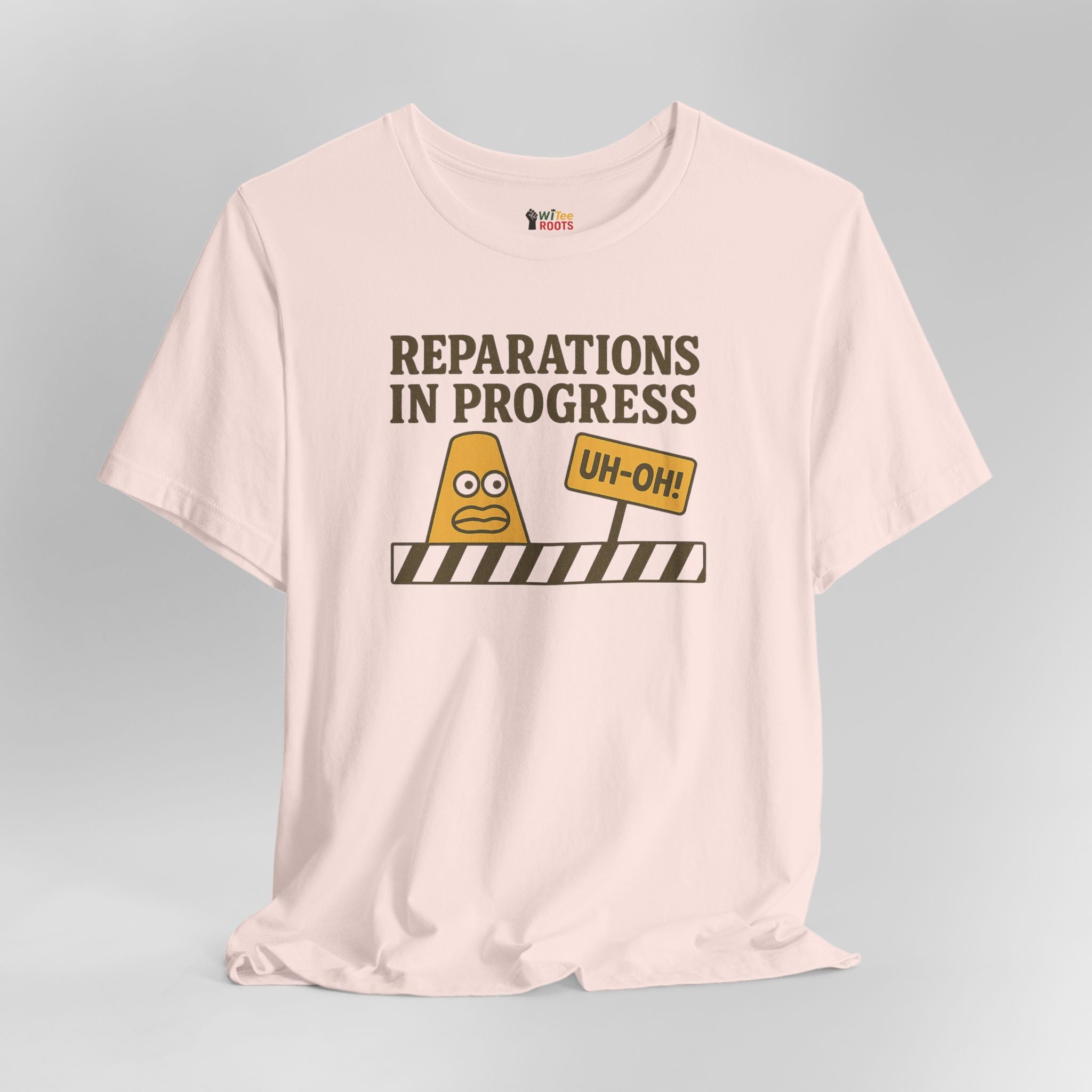 Pink t-shirt with graphic design and text on a gray background