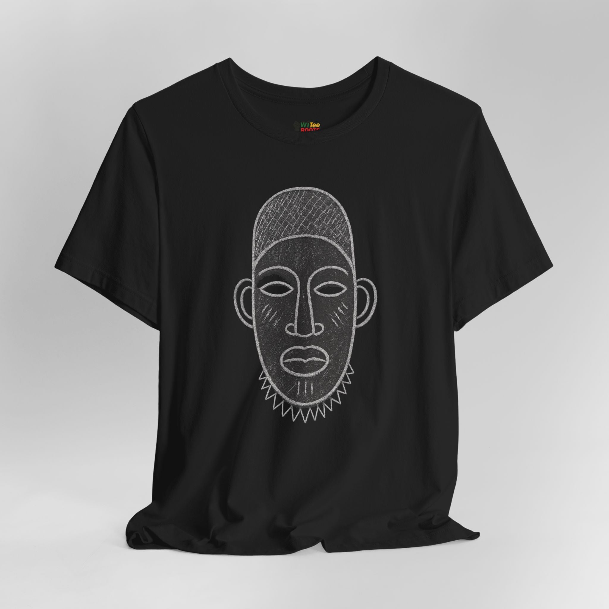 Black t-shirt with a face design on a gray background