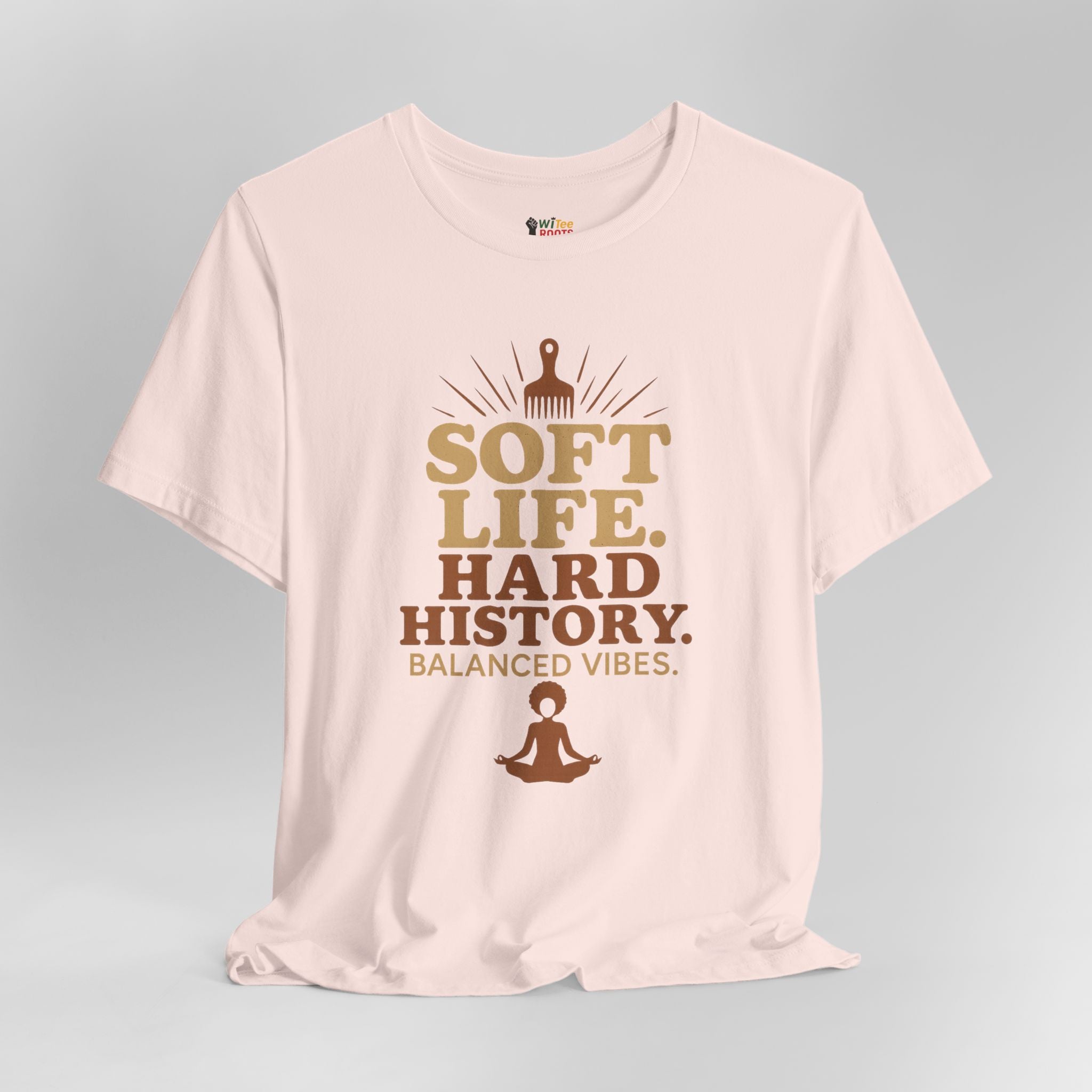 Pink t-shirt with motivational text and graphics on a gray background