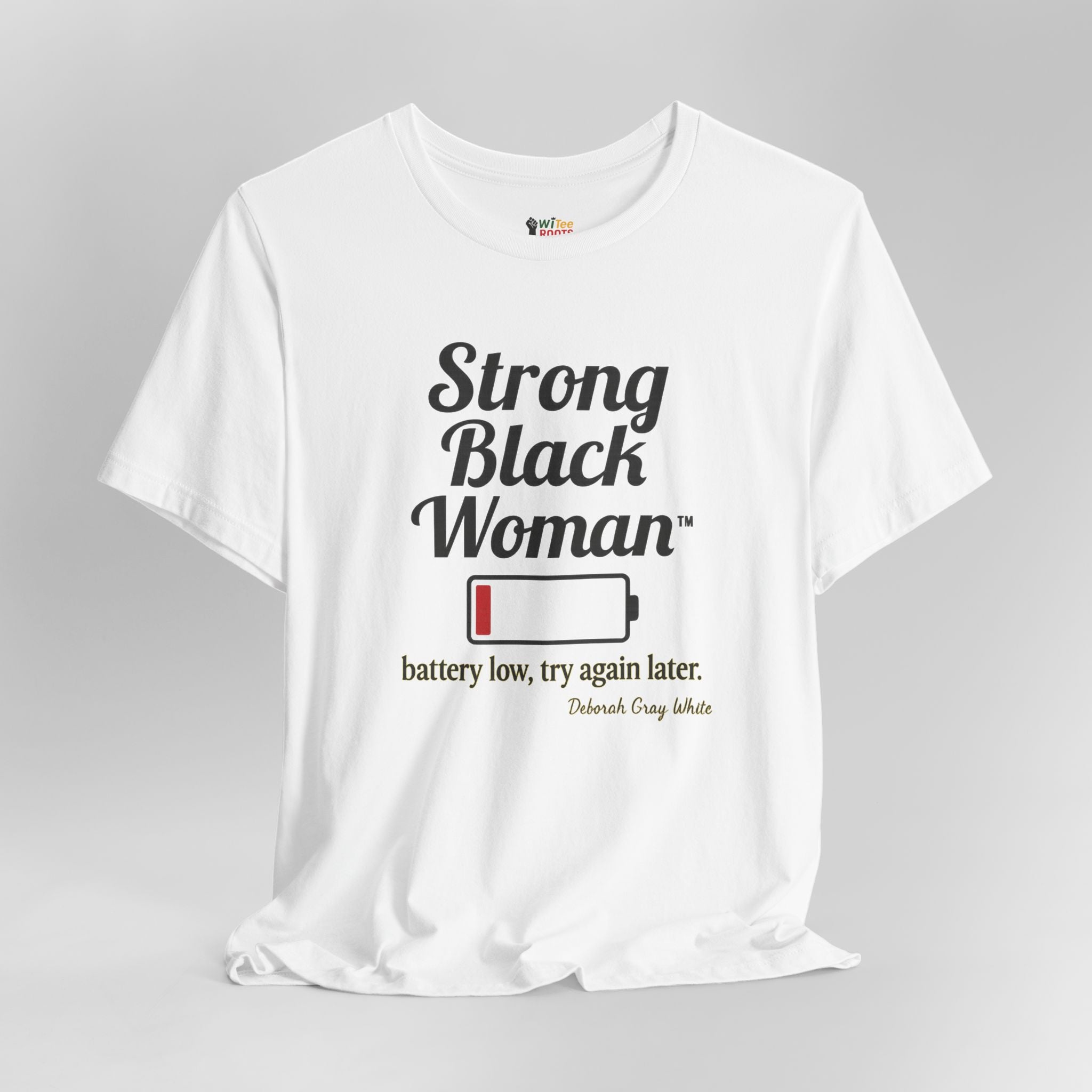 White t-shirt with 'Strong Black Woman' text and battery graphic on a gray background