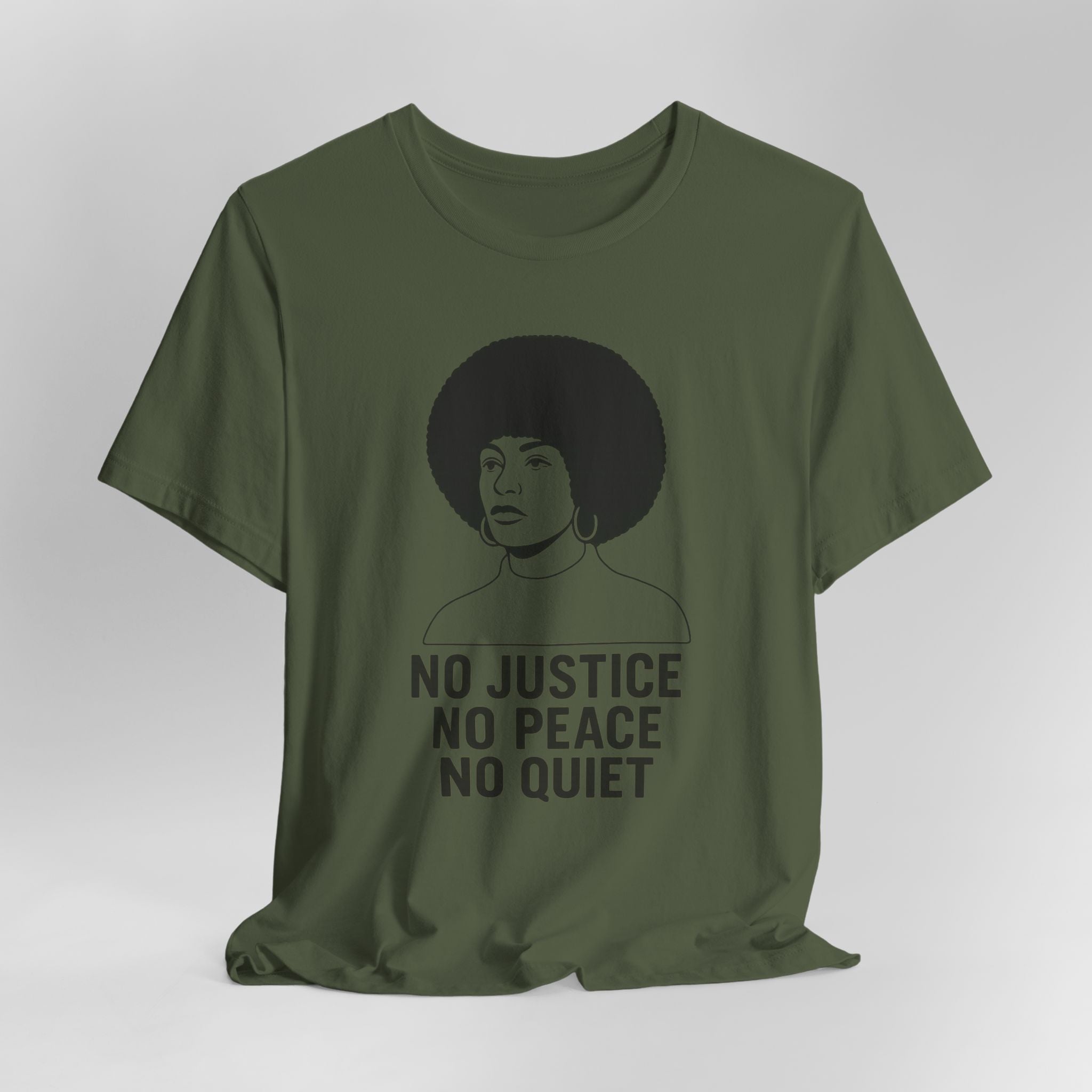 Green t-shirt with a graphic of a woman and text 'No Justice No Peace No Quiet' on a white background