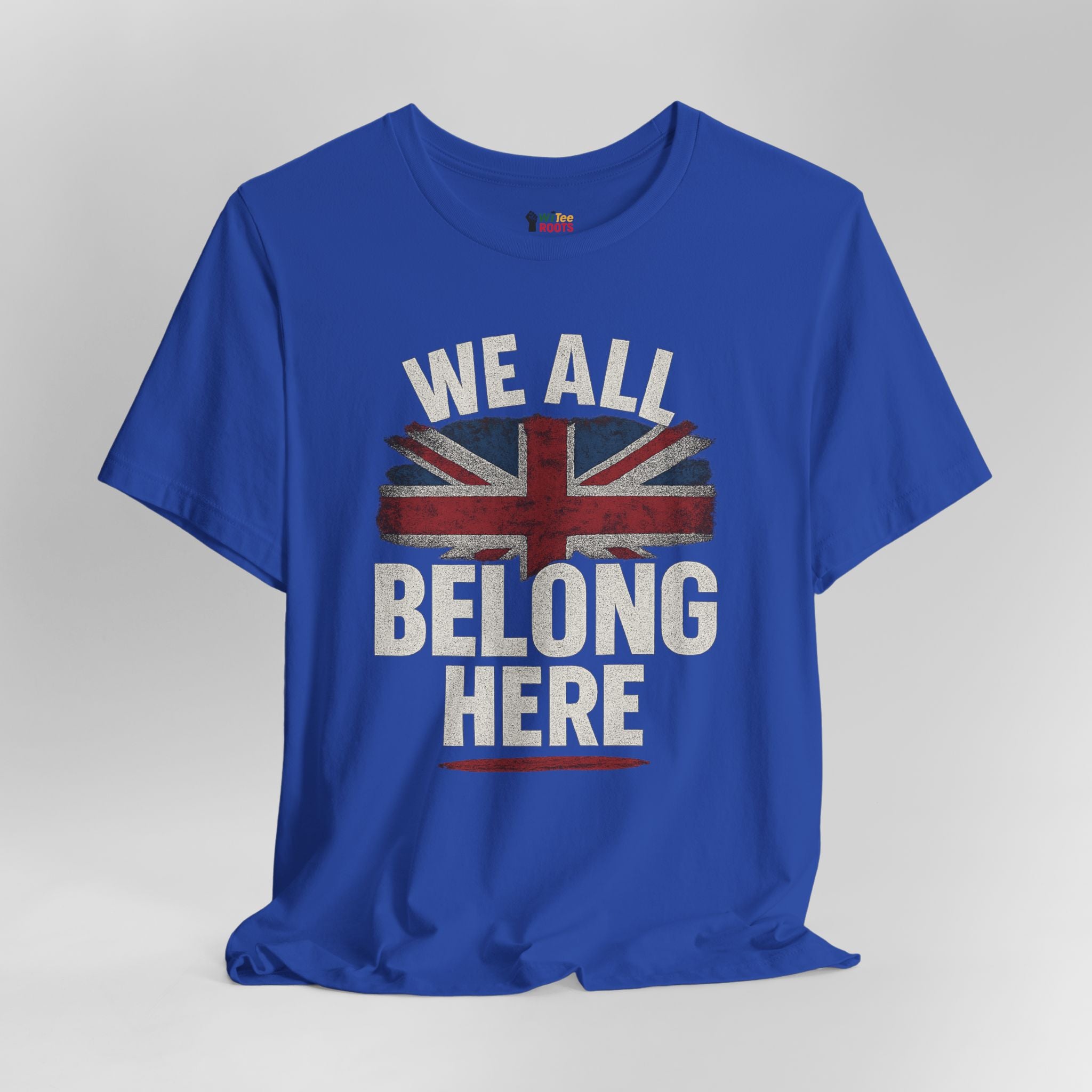 Blue t-shirt with 'We All Belong Here' text and Union Jack design on a gray background