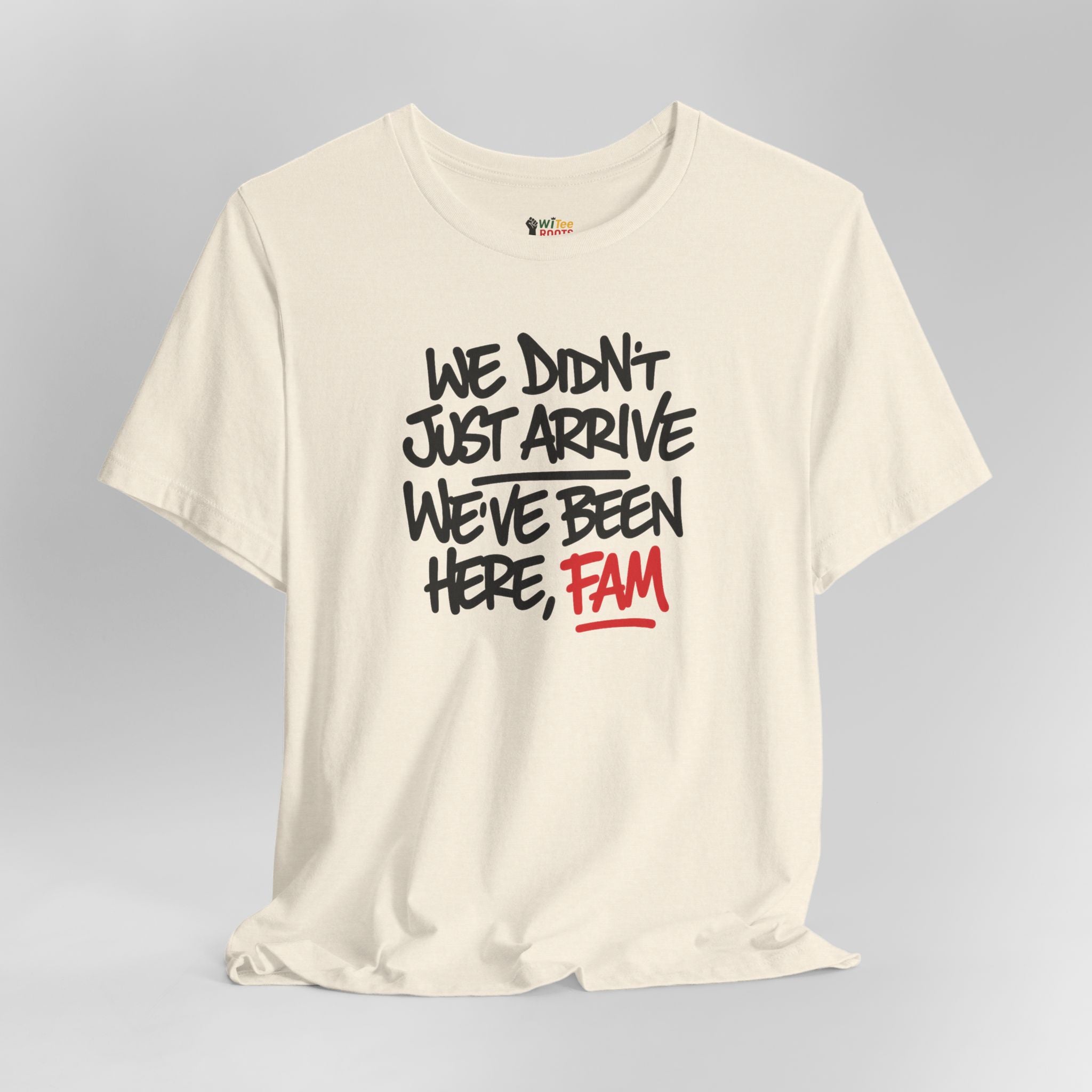 Beige t-shirt with black and red text on a gray background