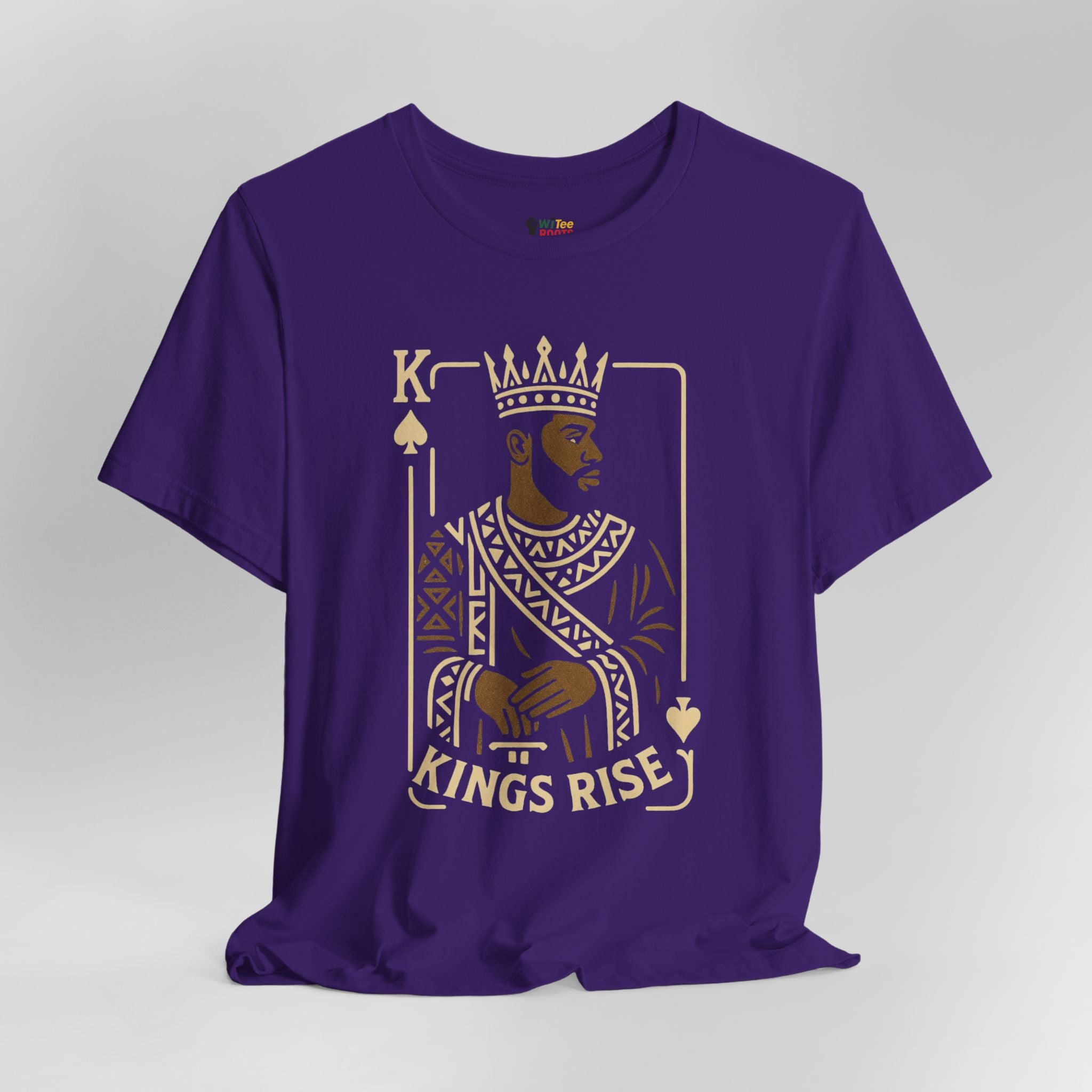 Purple t-shirt with a graphic design of a king and 'Kings Rise' text on a gray background