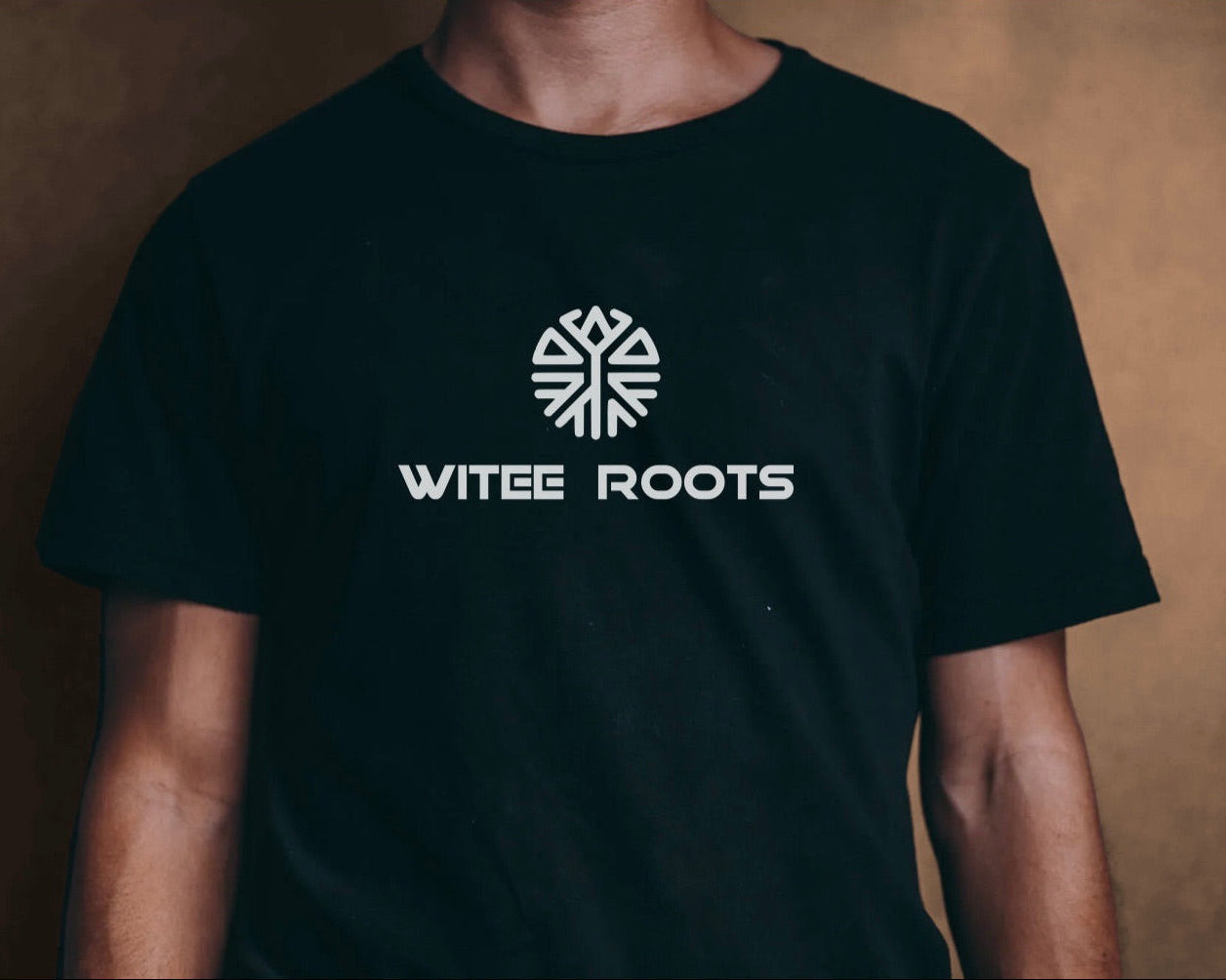 HERO image. Black t-shirt with 'WITEE ROOTS' logo on a brown background