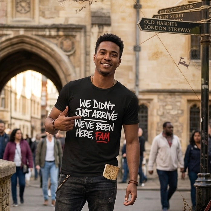 Man wearing a black t-shirt with text in an urban setting