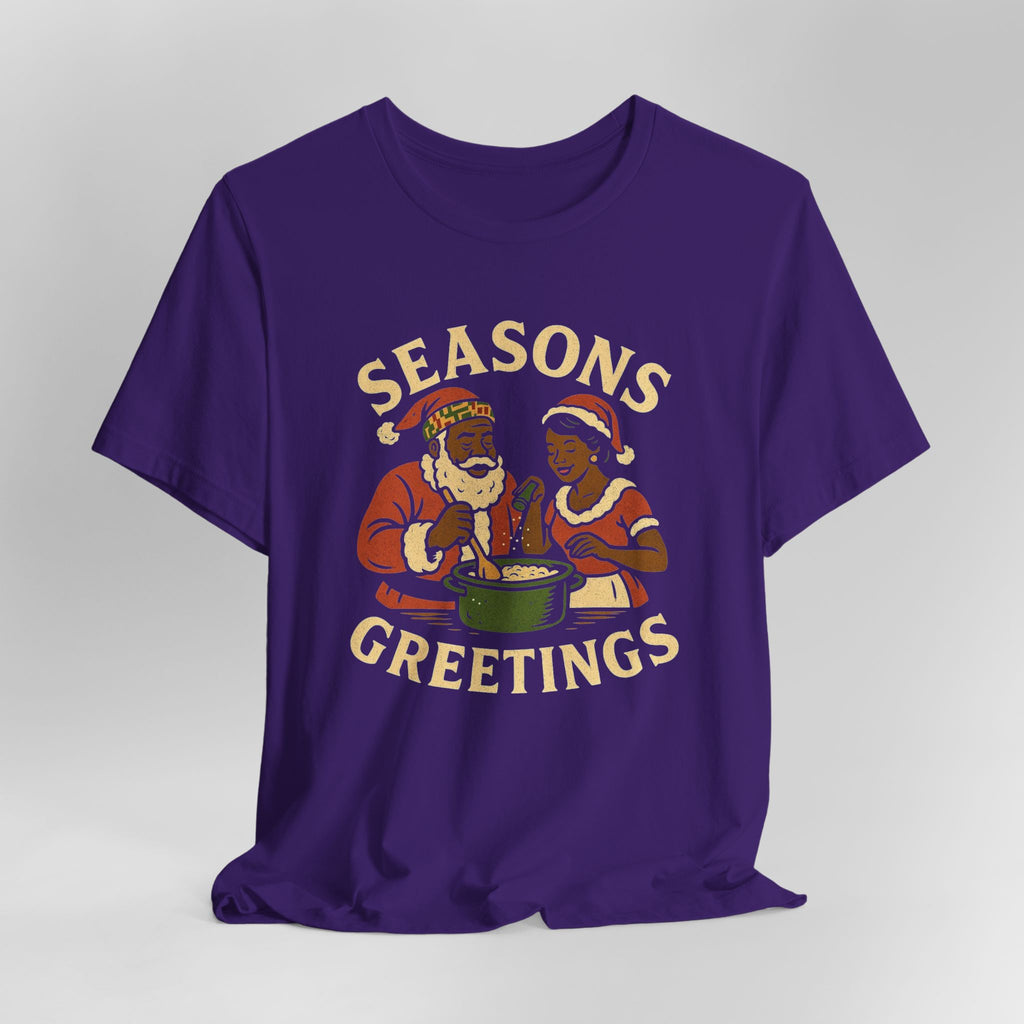 Purple t-shirt with 'Seasons Greetings' graphic on a gray background
