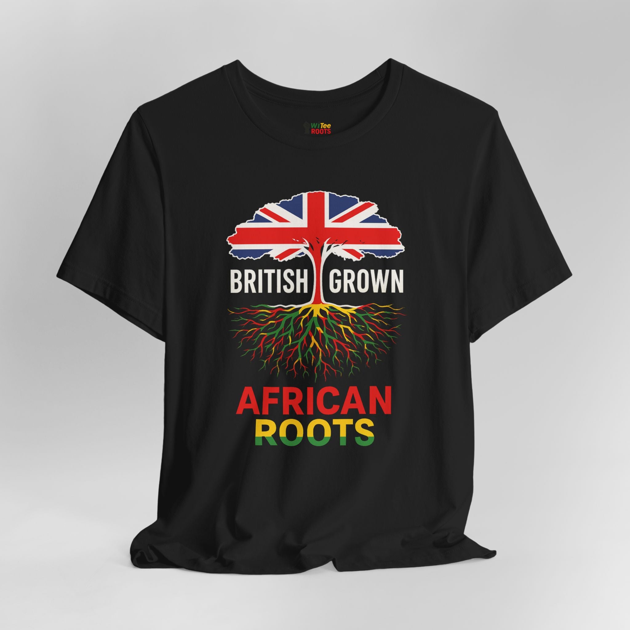 Black t-shirt with a design of a tree with British flag leaves and 'British Grown African Roots' text on a gray background.