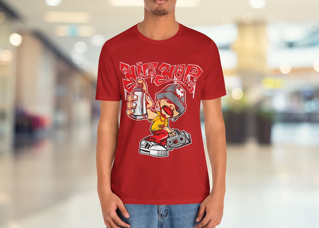 Person wearing a red t-shirt with a graphic design in an indoor setting