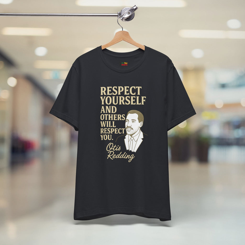 Black t-shirt with a quote and a man's face on a hanger in a store.