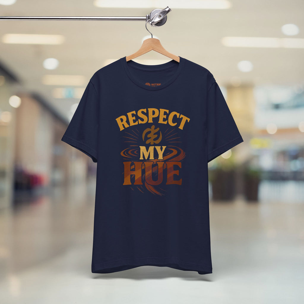 Navy blue t-shirt with 'Respect My Hue' text on a hanger in a store.