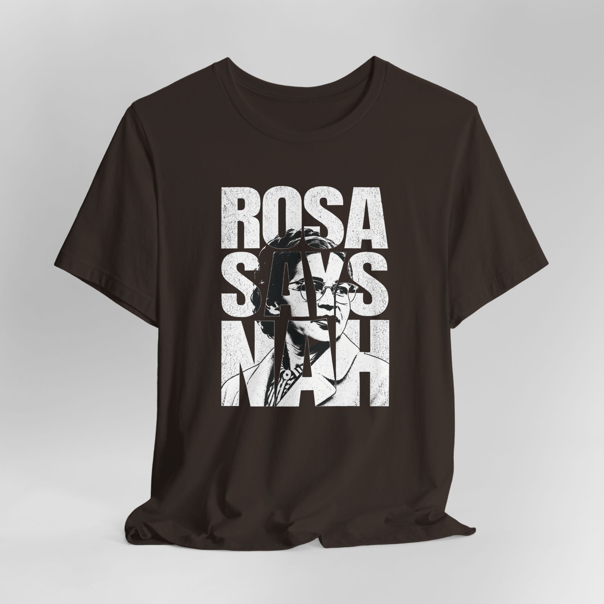 Brown t-shirt with graphic design and text on a gray background