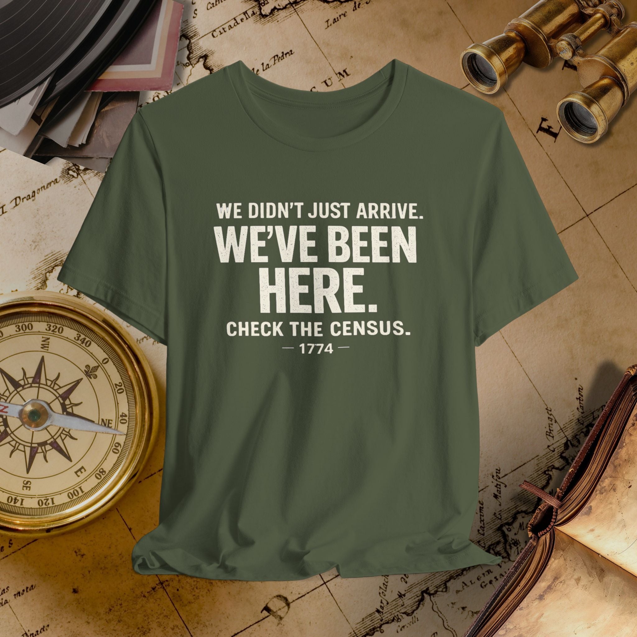 Green t-shirt with humorous text on a vintage map background